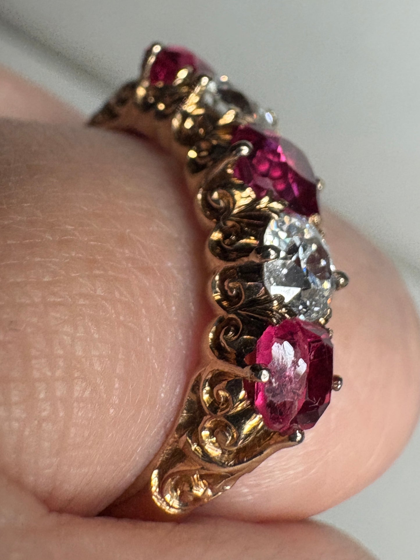 Antique 14k gold band ring with red spinel and old mine cut diamonds.