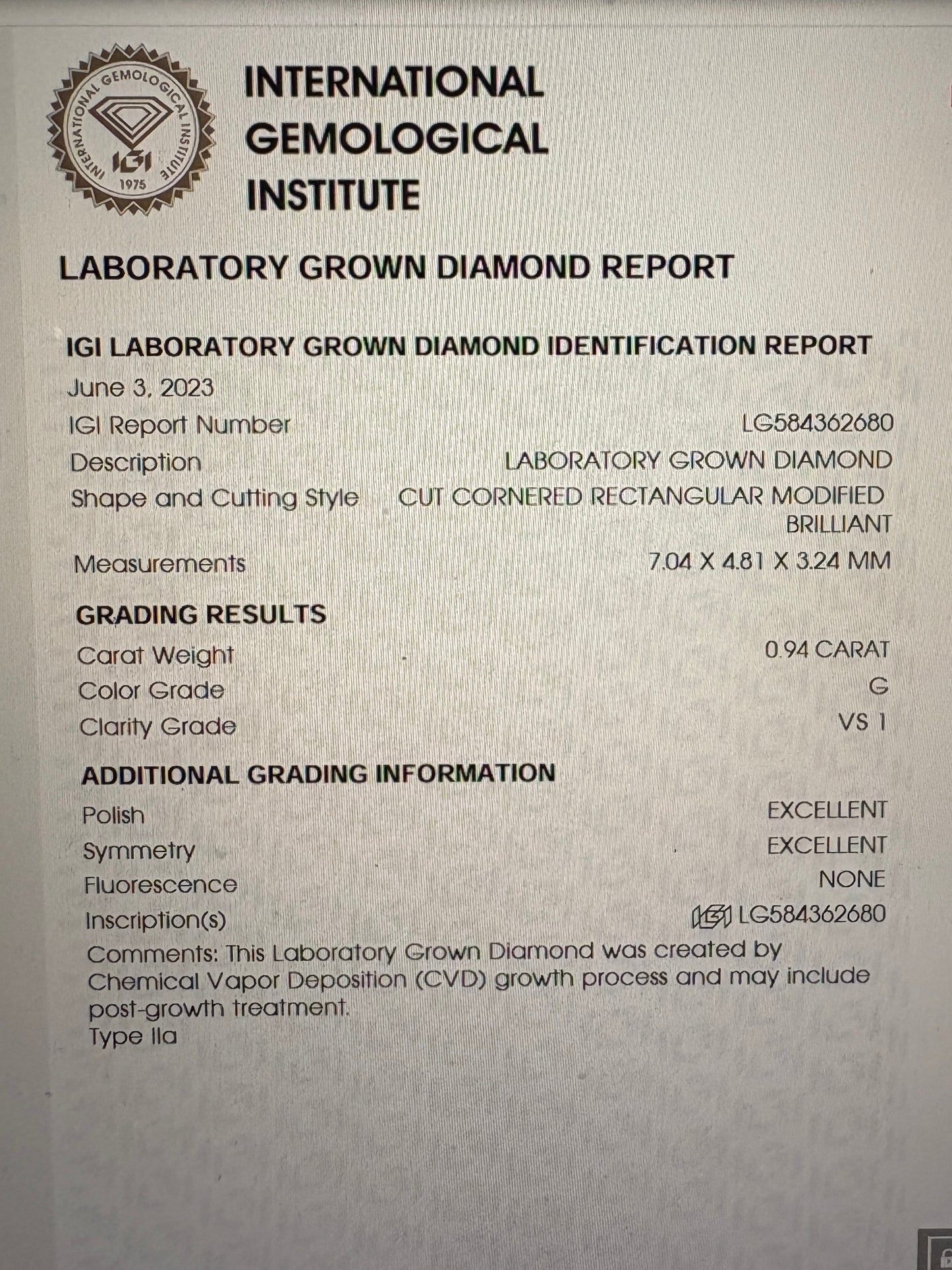 IGI report for a 0.94 carat cut cornered rectangular modified brilliant diamond.