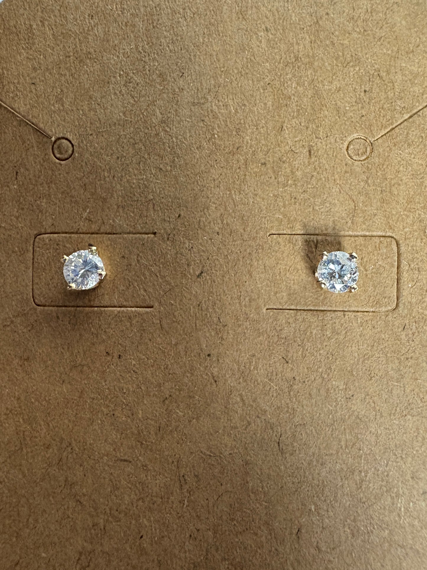 Natural diamond solitaire stud earrings in solid 14k gold.