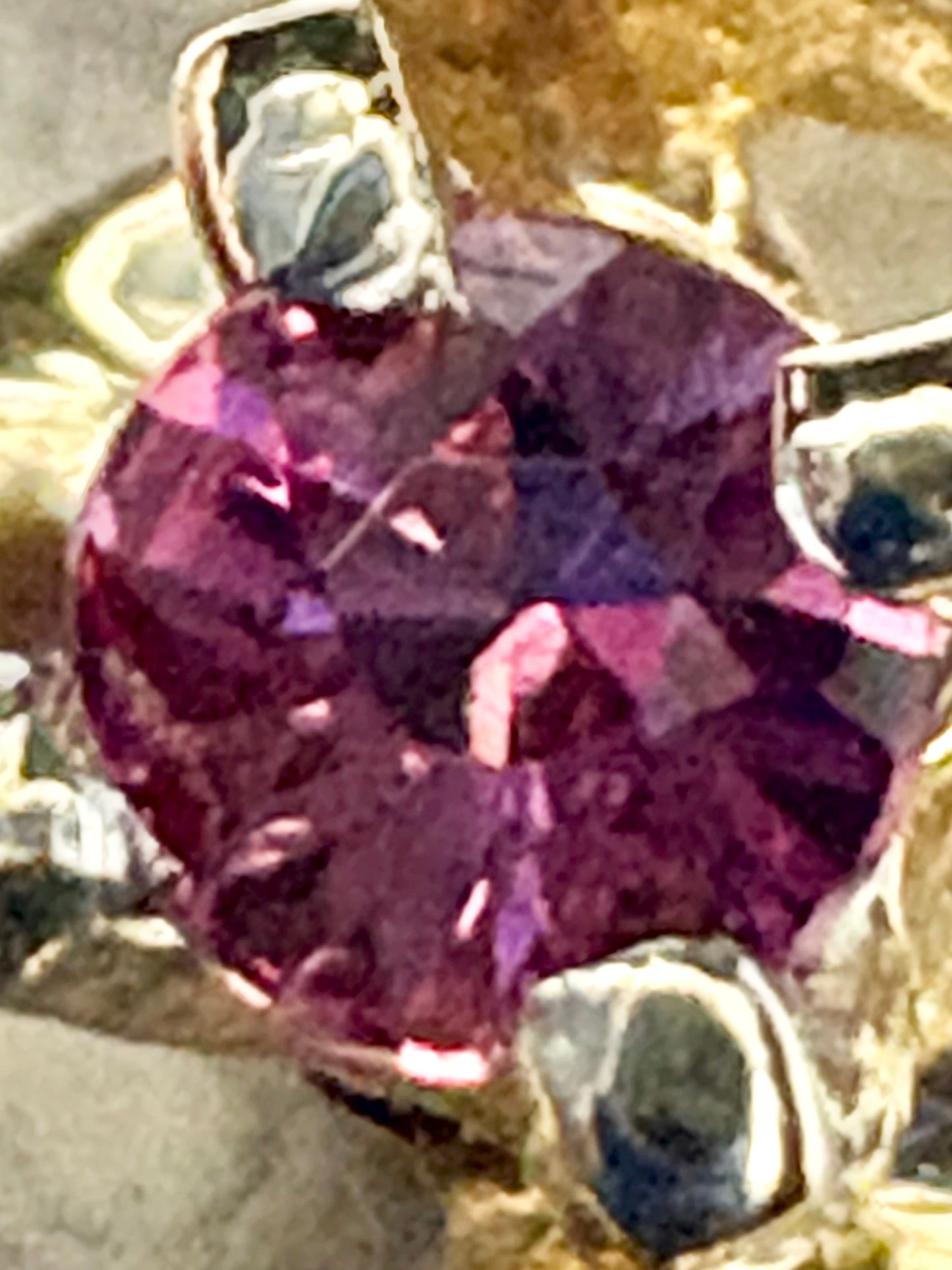 Ribbon style ring in solid 10k gold with a natural bixbite red emerald.