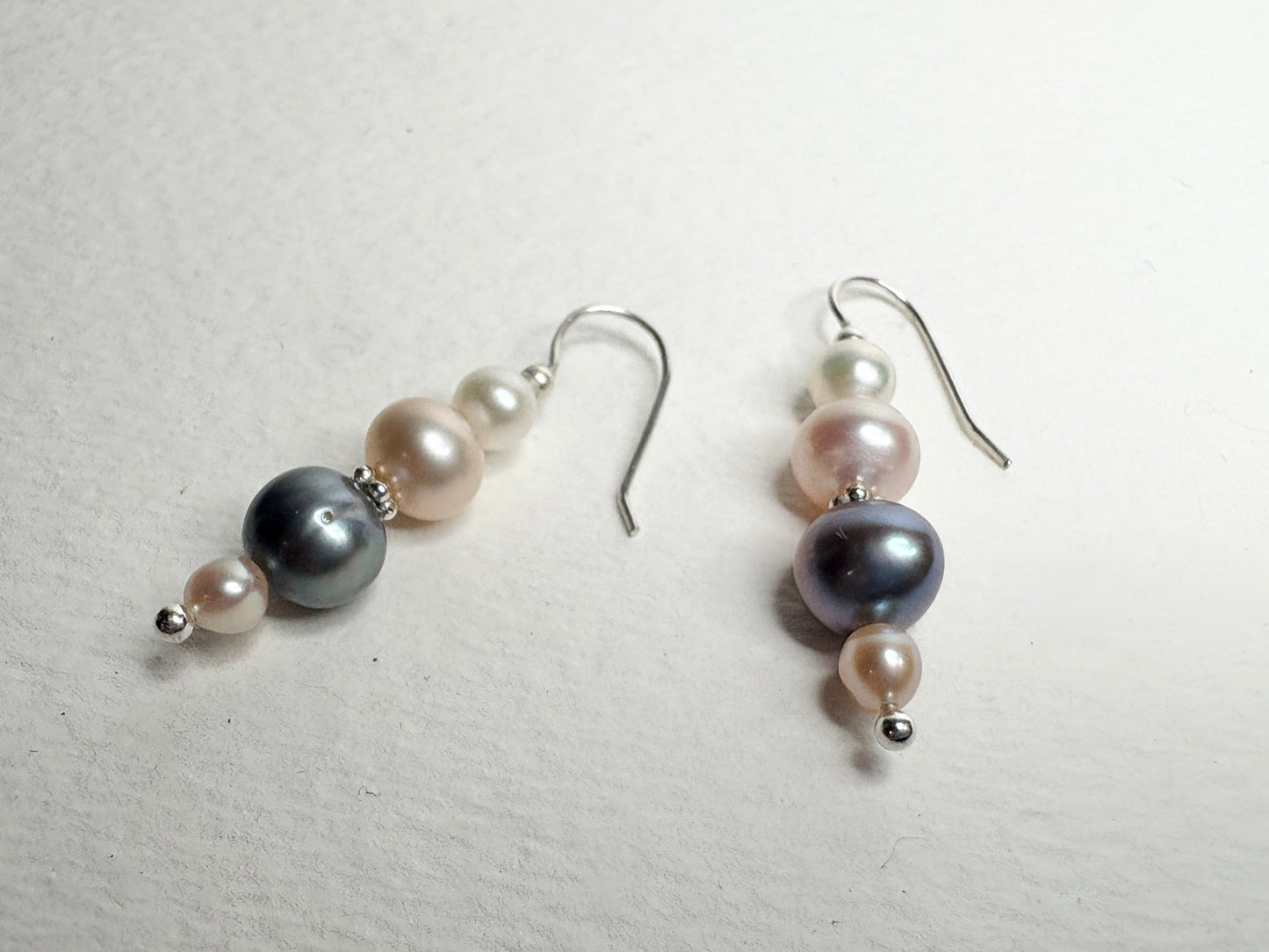 Sterling silver dangle earrings with colorful freshwater pearls.