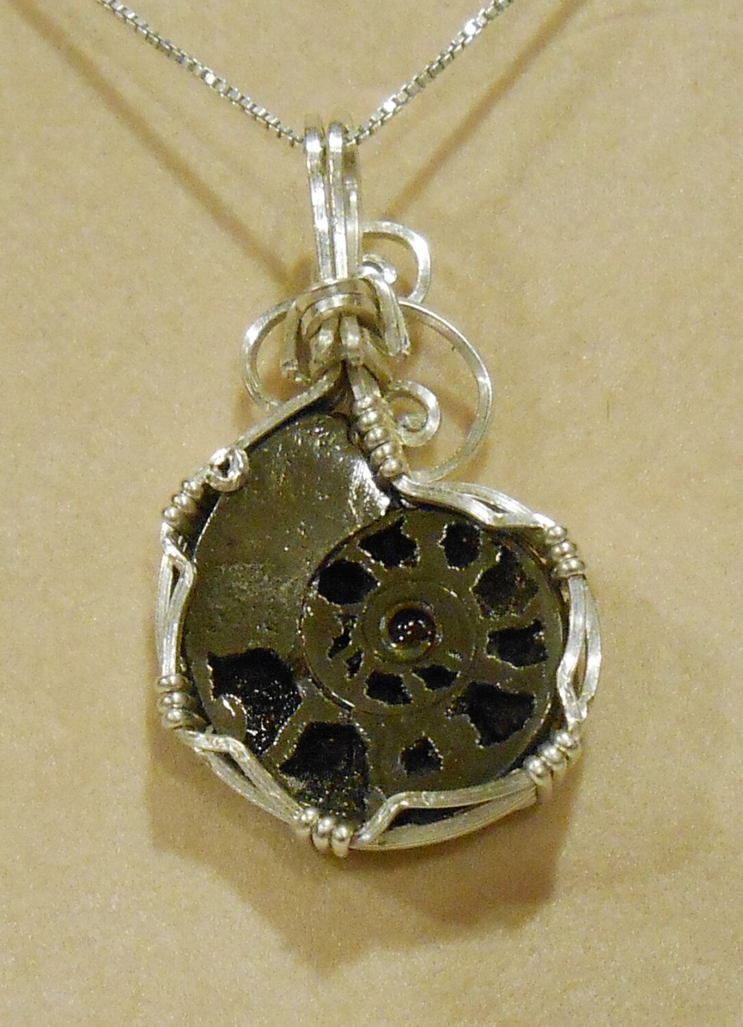 Pyritized Ammonite fossil pendant with ammolite features sterling silver wire wrapped