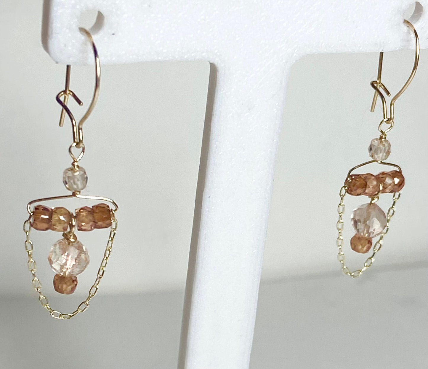 Solid 14k gold dangle earrings with Oregon Sunstone and natural zircons.