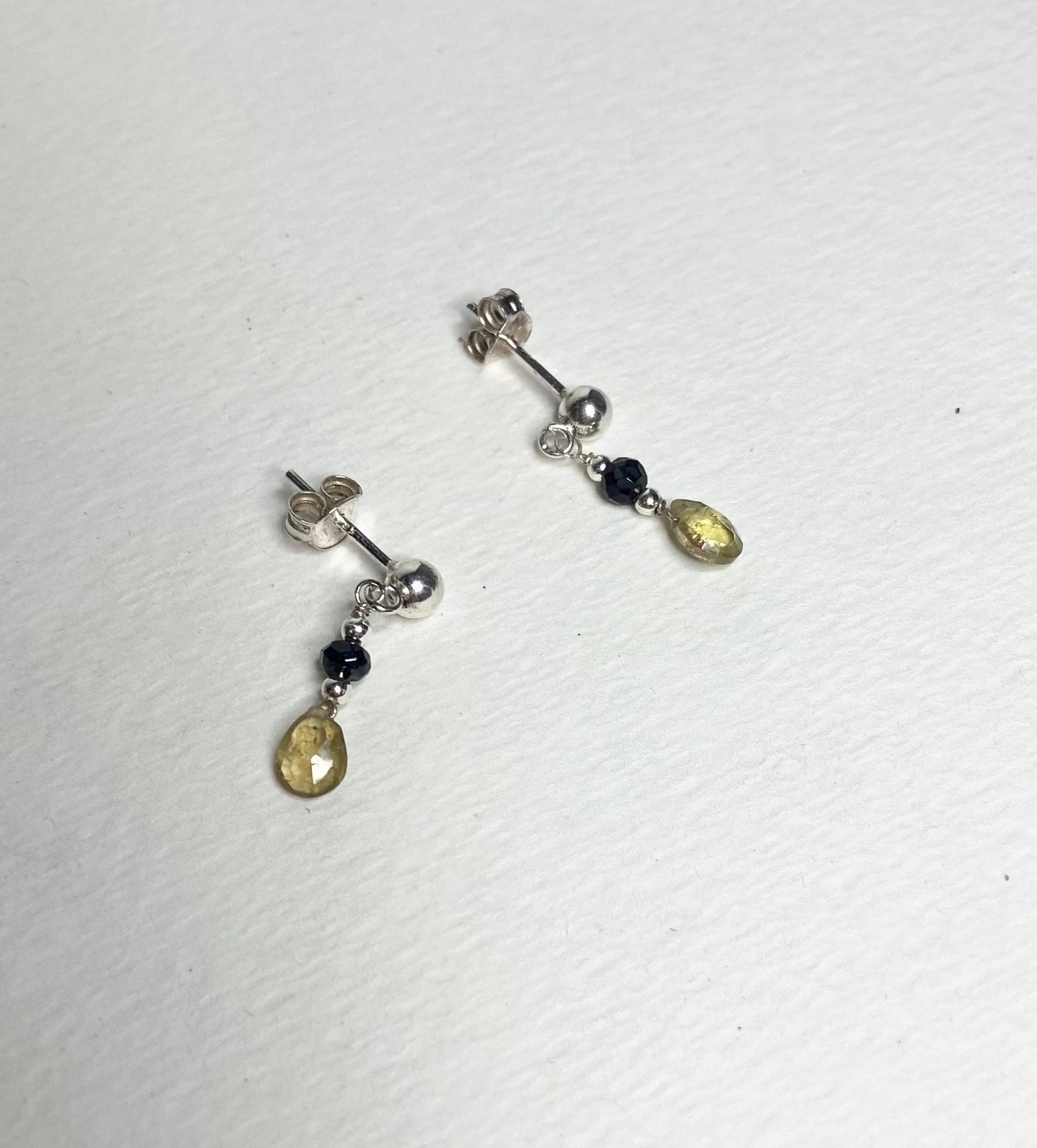 Sterling silver dangle earrings with black and yellow tourmaline beads.