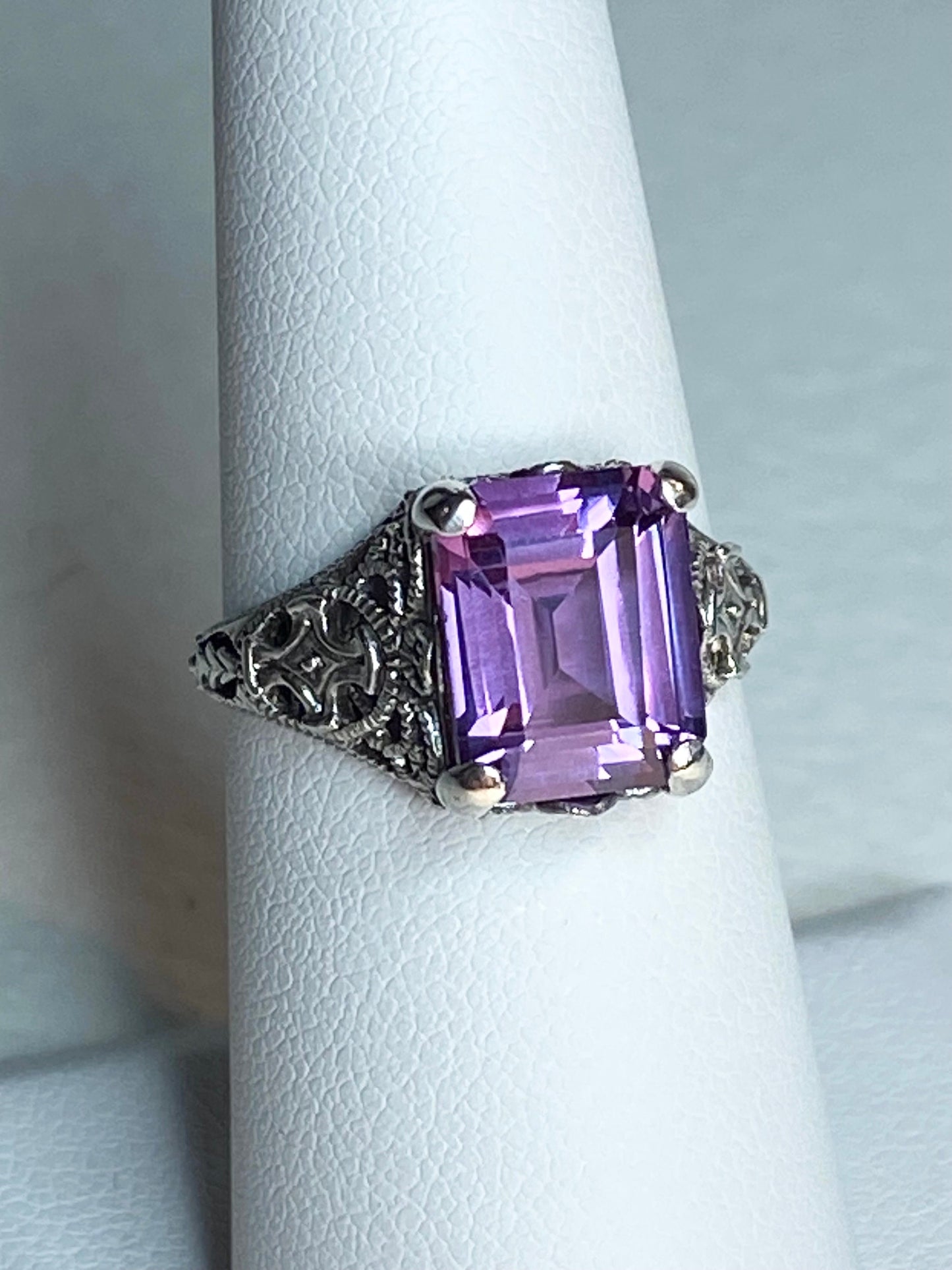 Art Deco sterling silver ring with a large emerald-cut synthetic color-change sapphire.