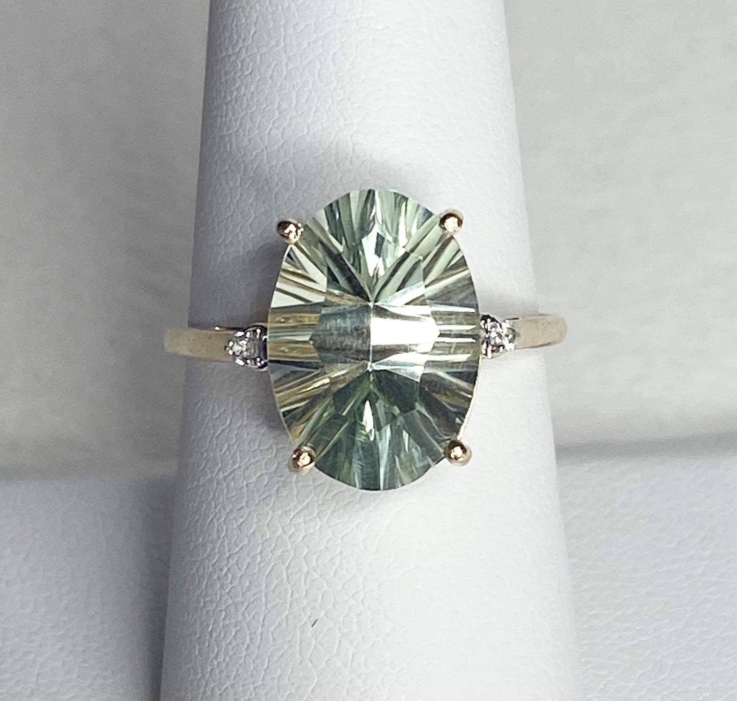 Oval fancy cut prasiolite green quartz ring with zircon accents in 9k yellow gold.