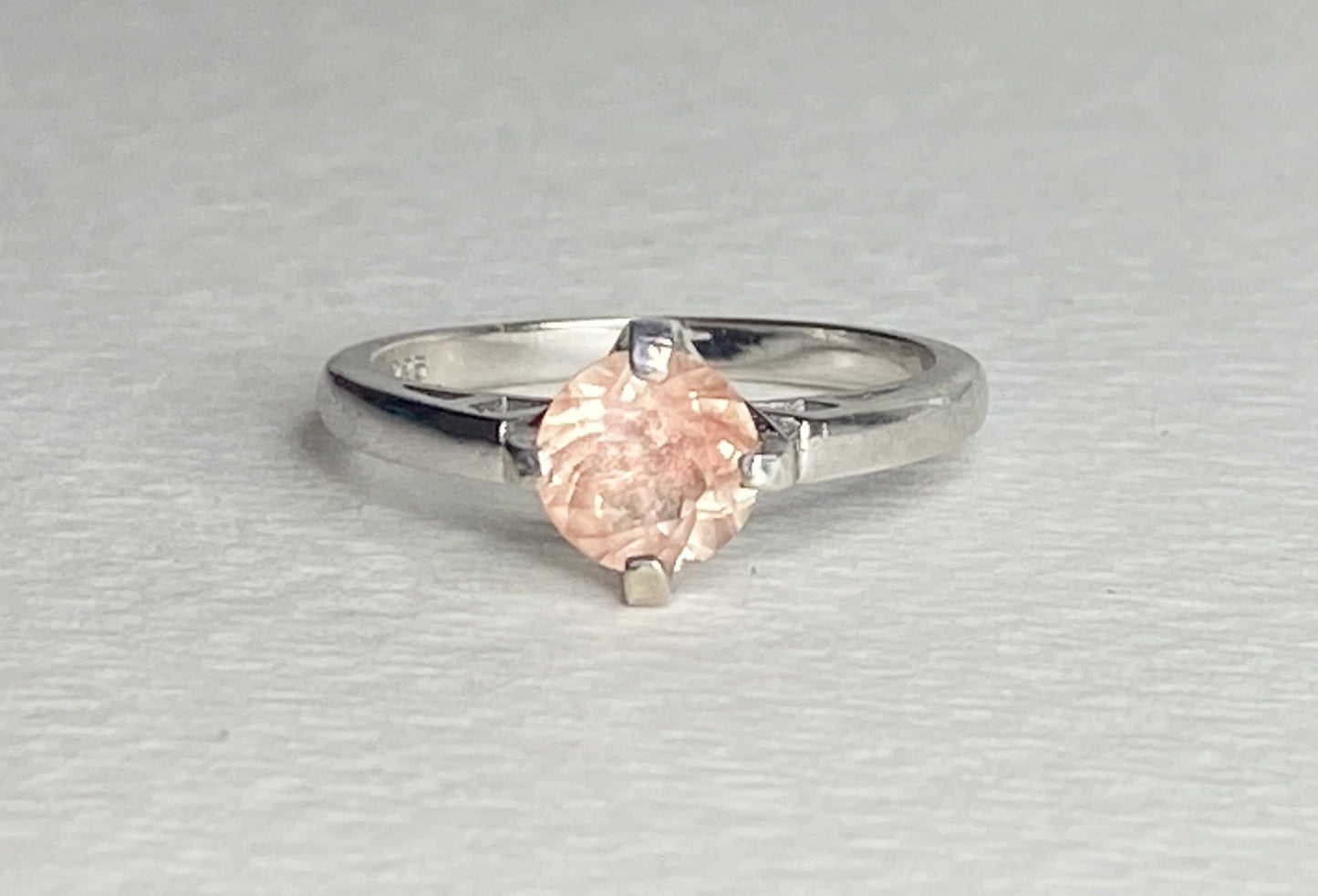 Sterling silver ring with a marquise-cut peach sunstone.