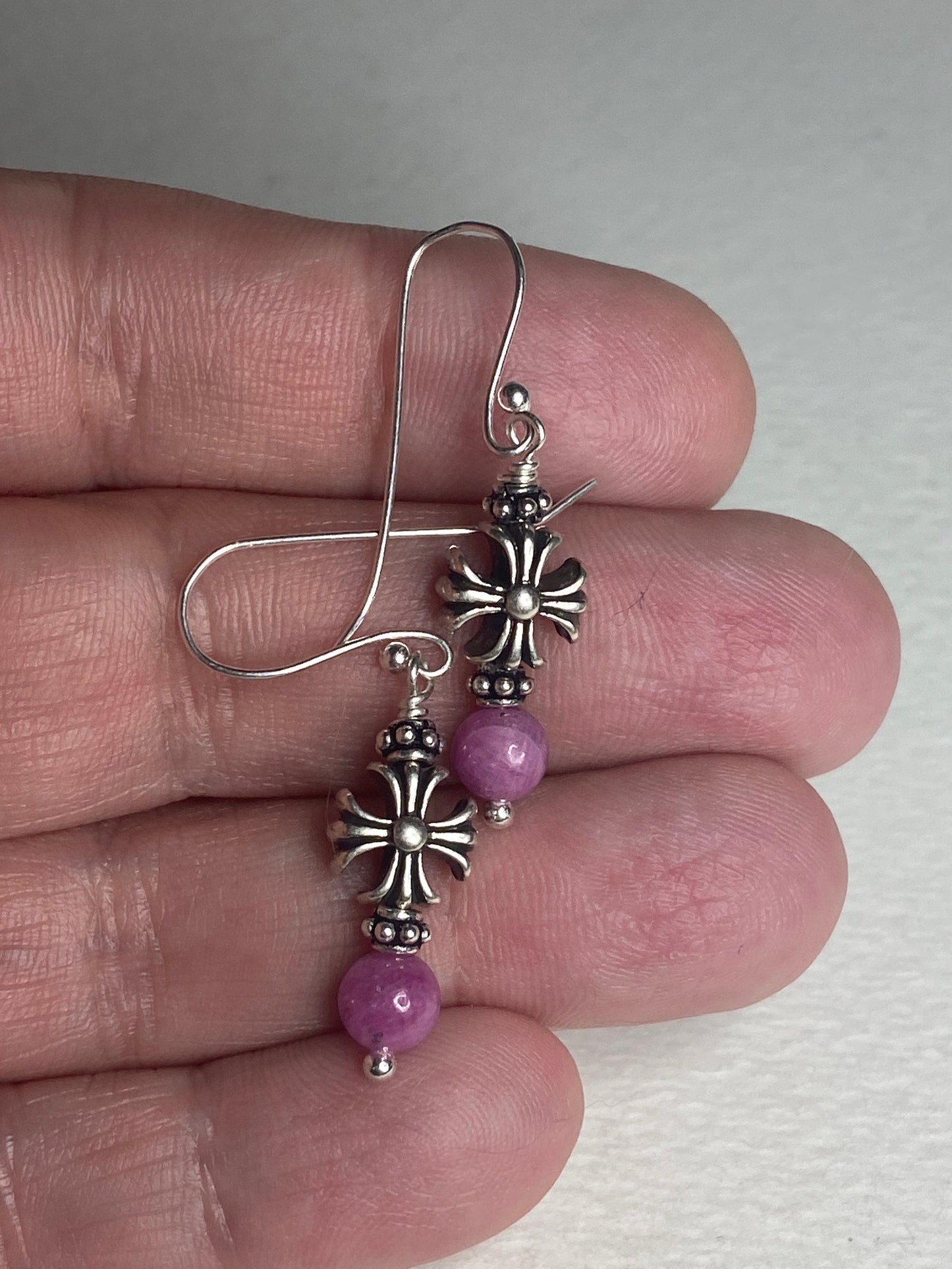 Sterling silver dangle earrings with pink sapphire beads and cross charms.