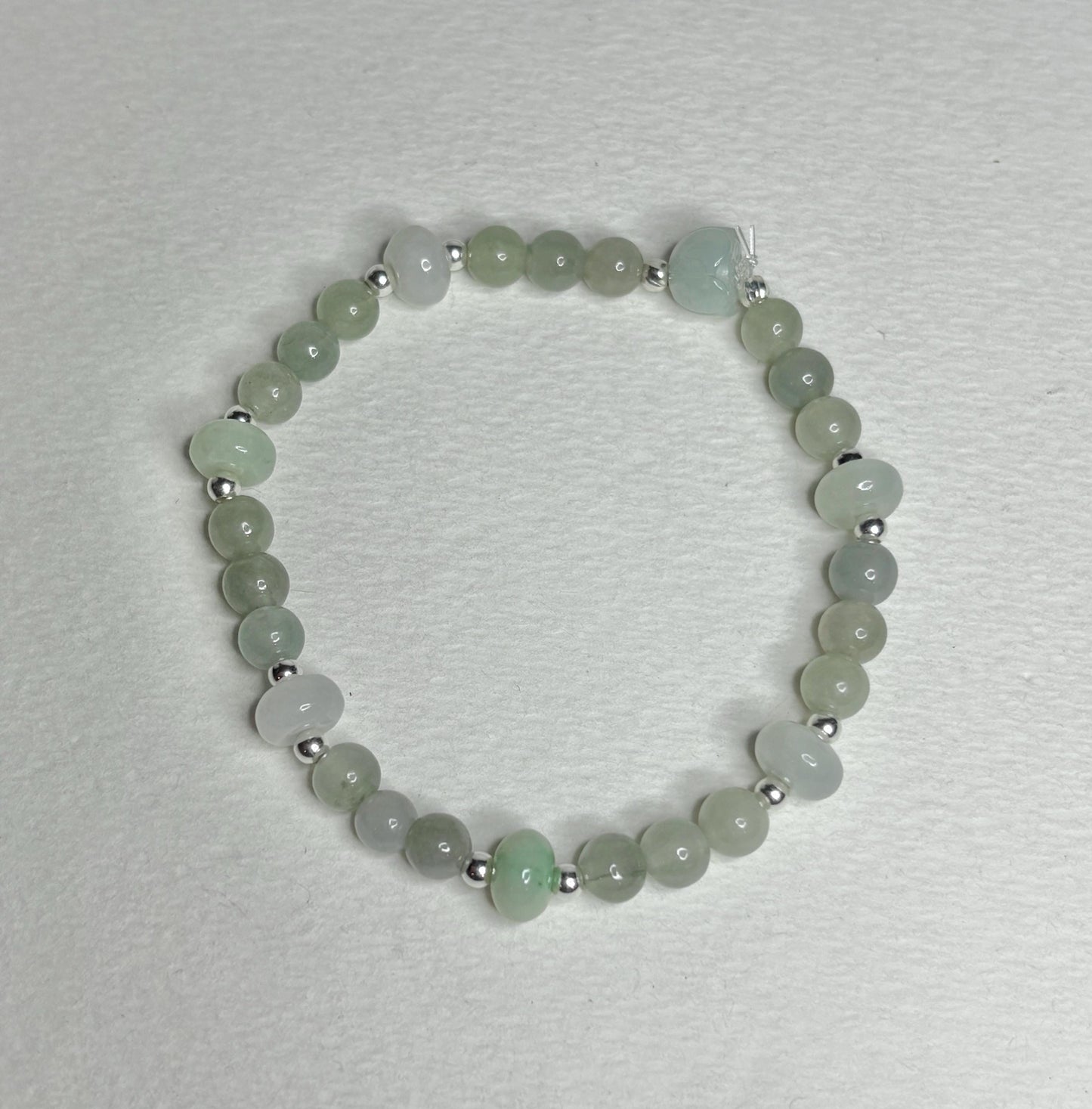 Natural Type A Icy Burmese Jadeite Jade Sterling Silver Stretch Bracelet with round and lotus bud beads.
