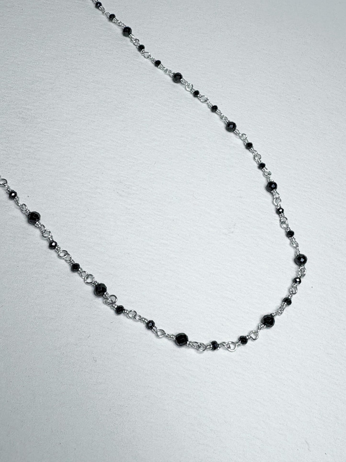 Sterling silver necklace with black diamond beads.