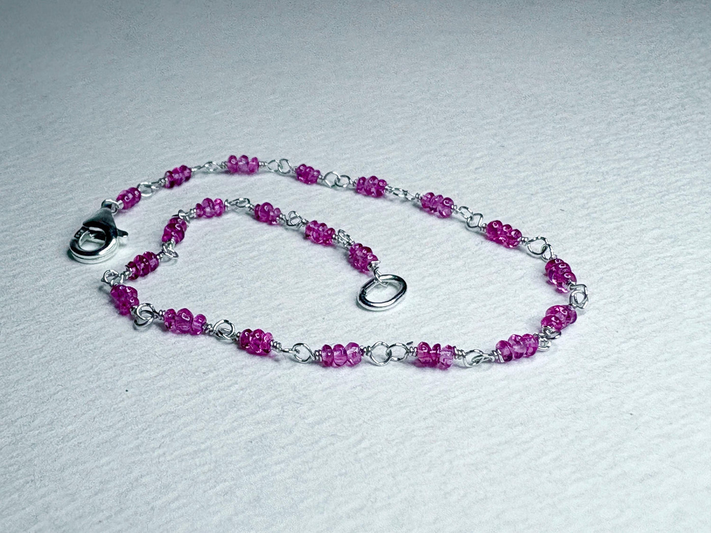 Sterling silver bracelet with natural hot pink Burmese spinel beads.