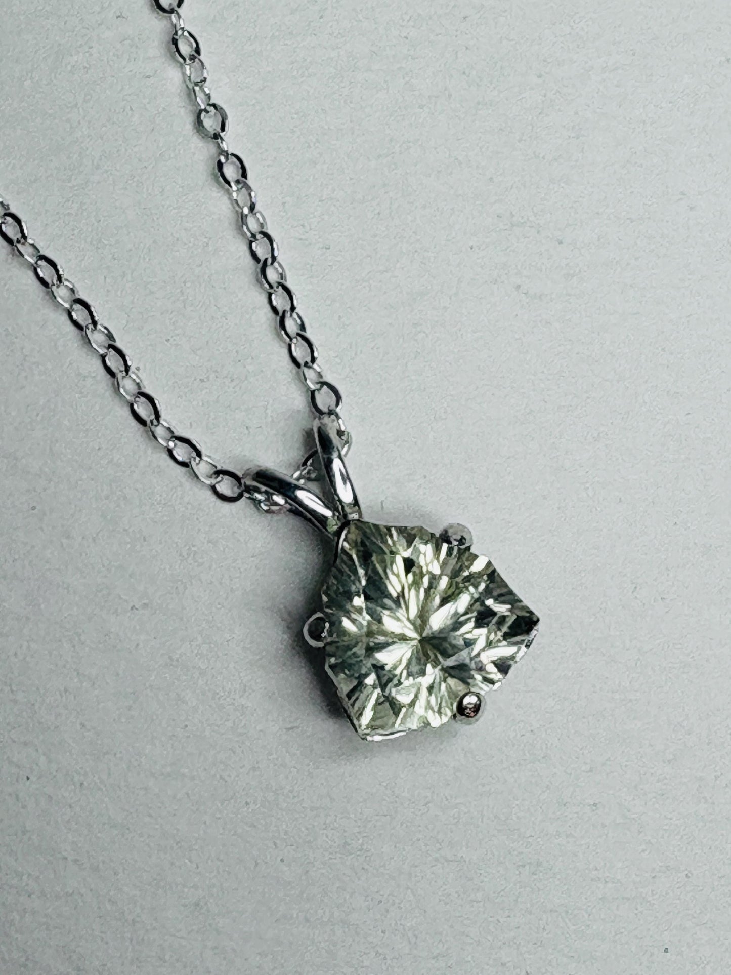 Sterling silver pendant necklace with a 10mm trillion-cut Oregon sunstone.