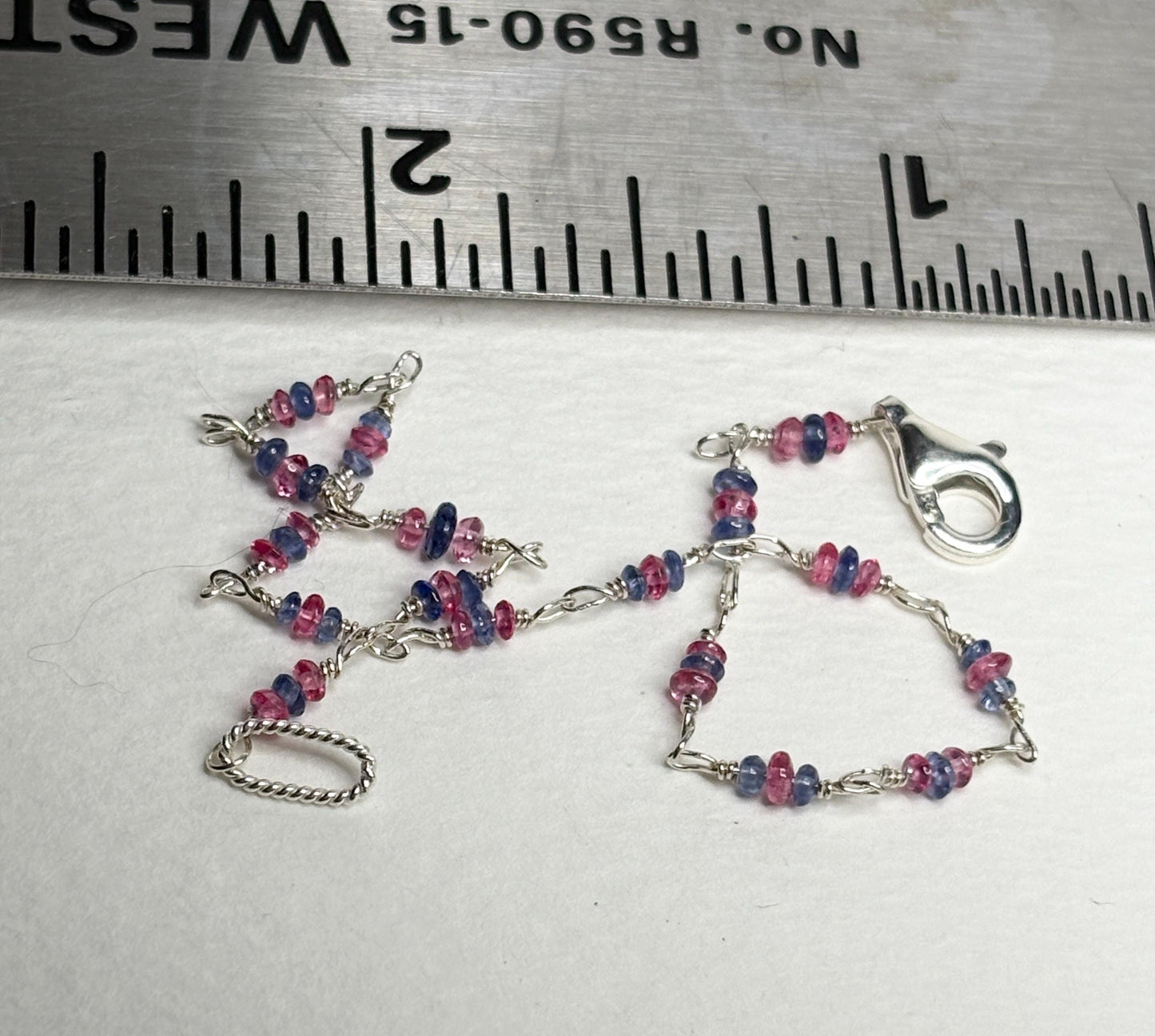 Dainty sterling silver bracelet with tiny Burmese sapphire and pink spinel beads.