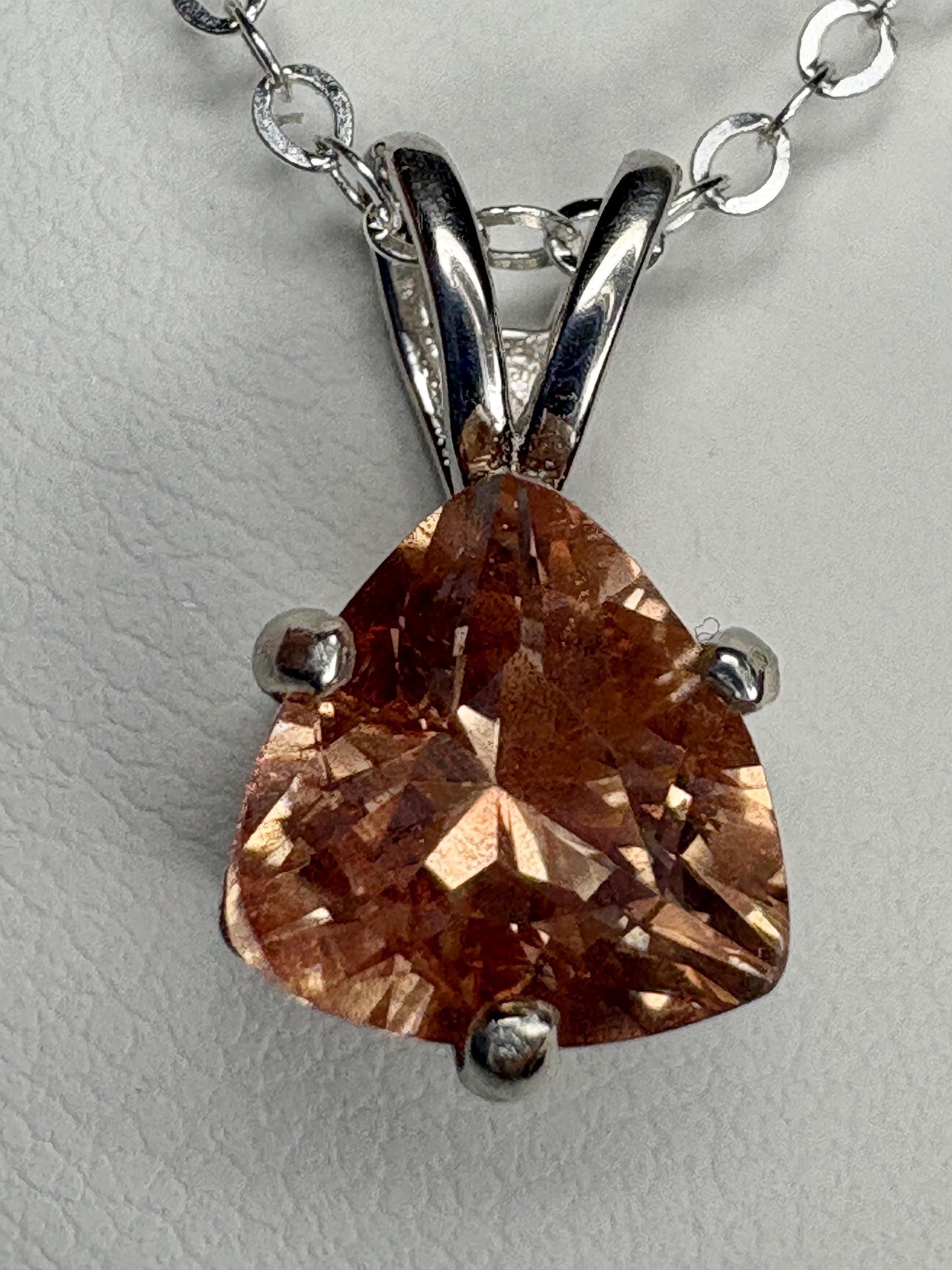 Sterling silver pendant necklace with a peach Oregon sunstone.
