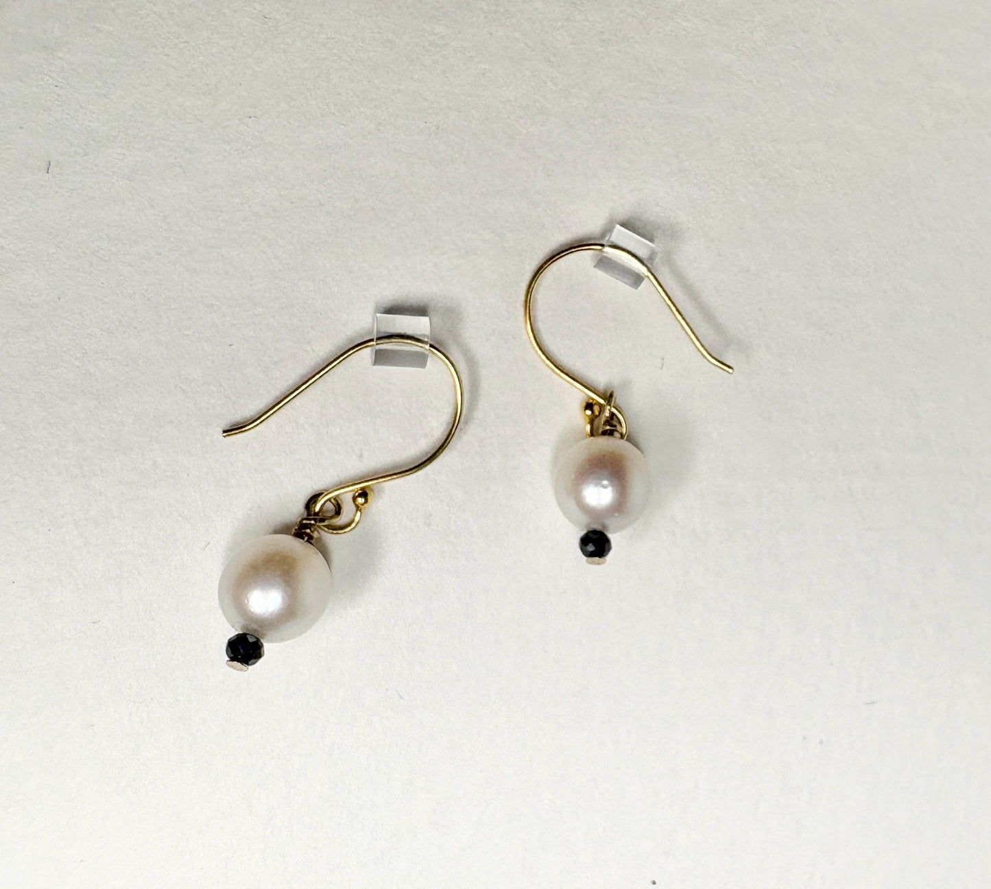 14k gold dangle earrings with Akoya pearls and black diamond beads.