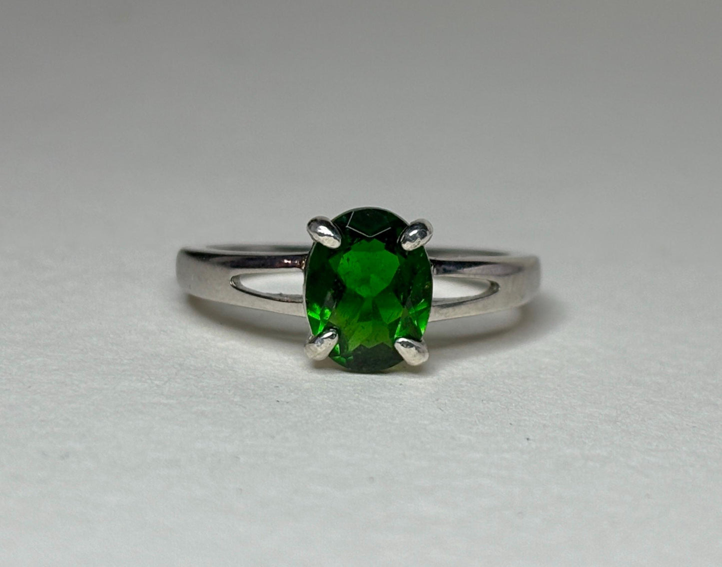 Oval chrome diopside solitaire ring in sterling silver.