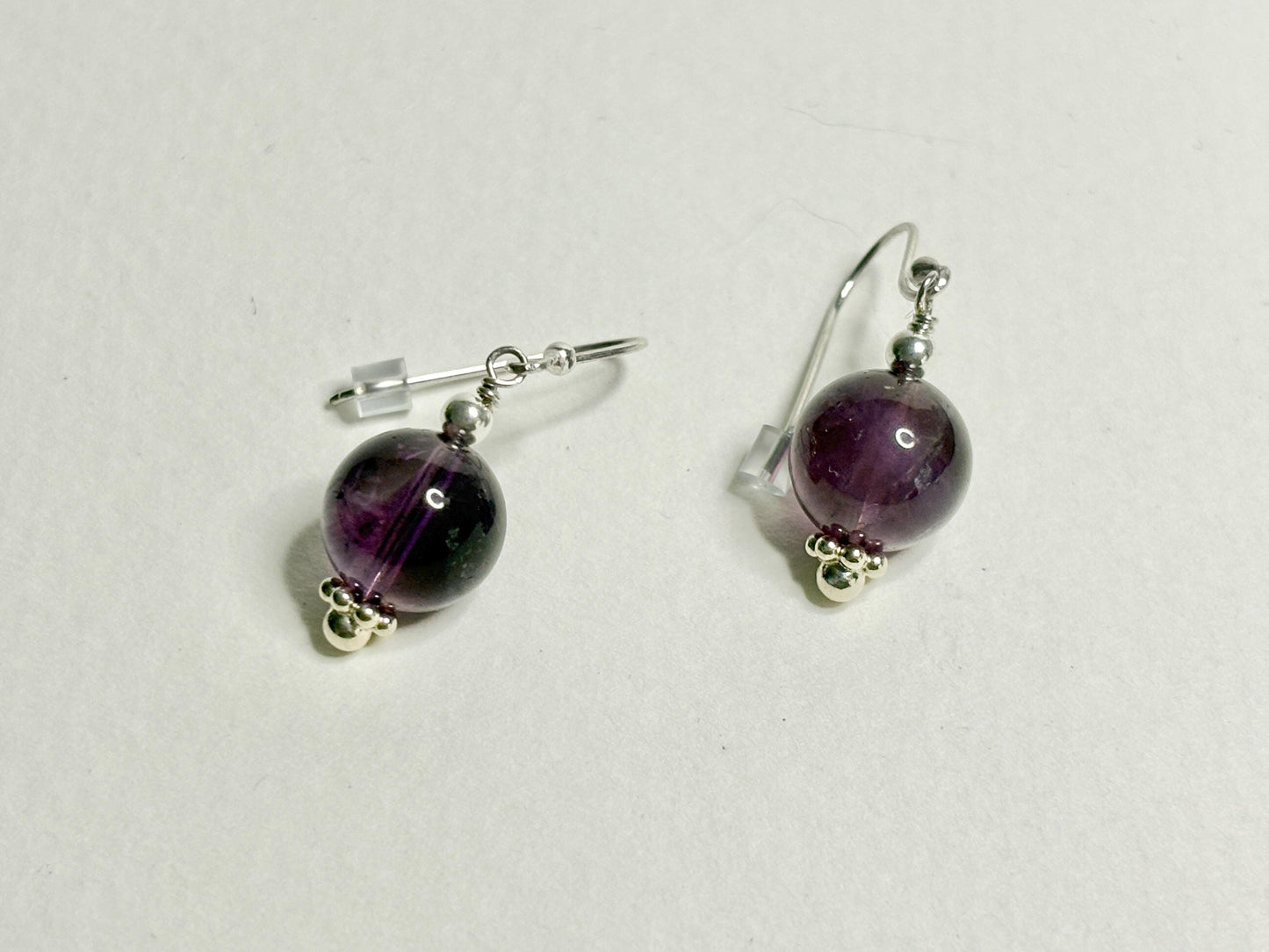 Sterling silver dangle earrings with 10mm natural amethyst beads.