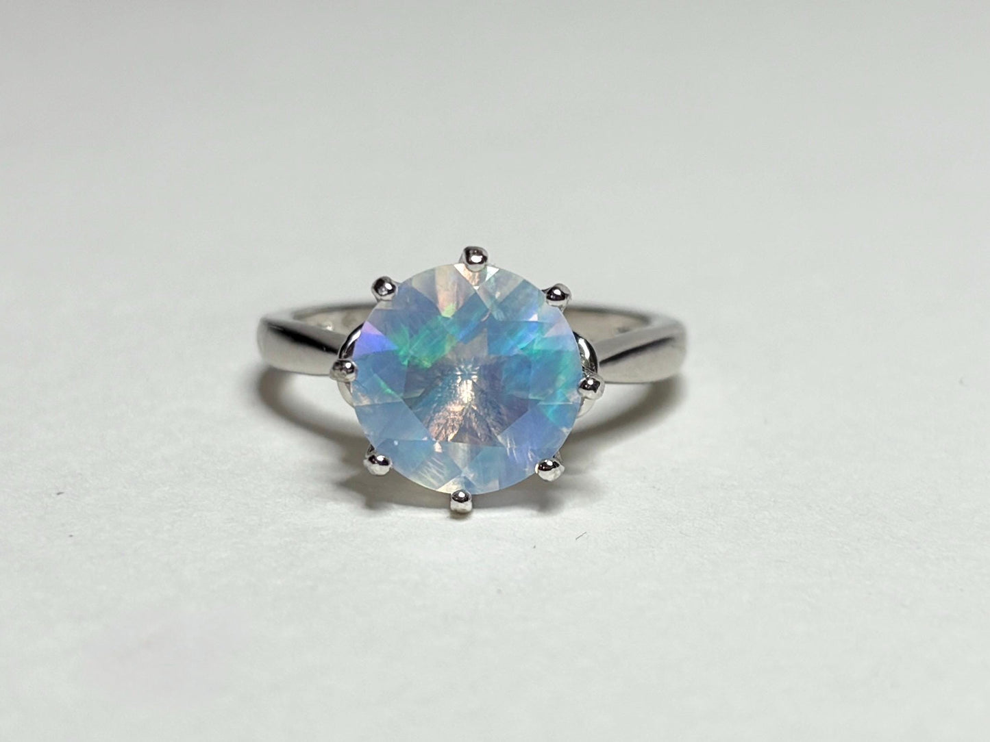 Sterling silver ring with a faceted Ethiopian crystal opal.
