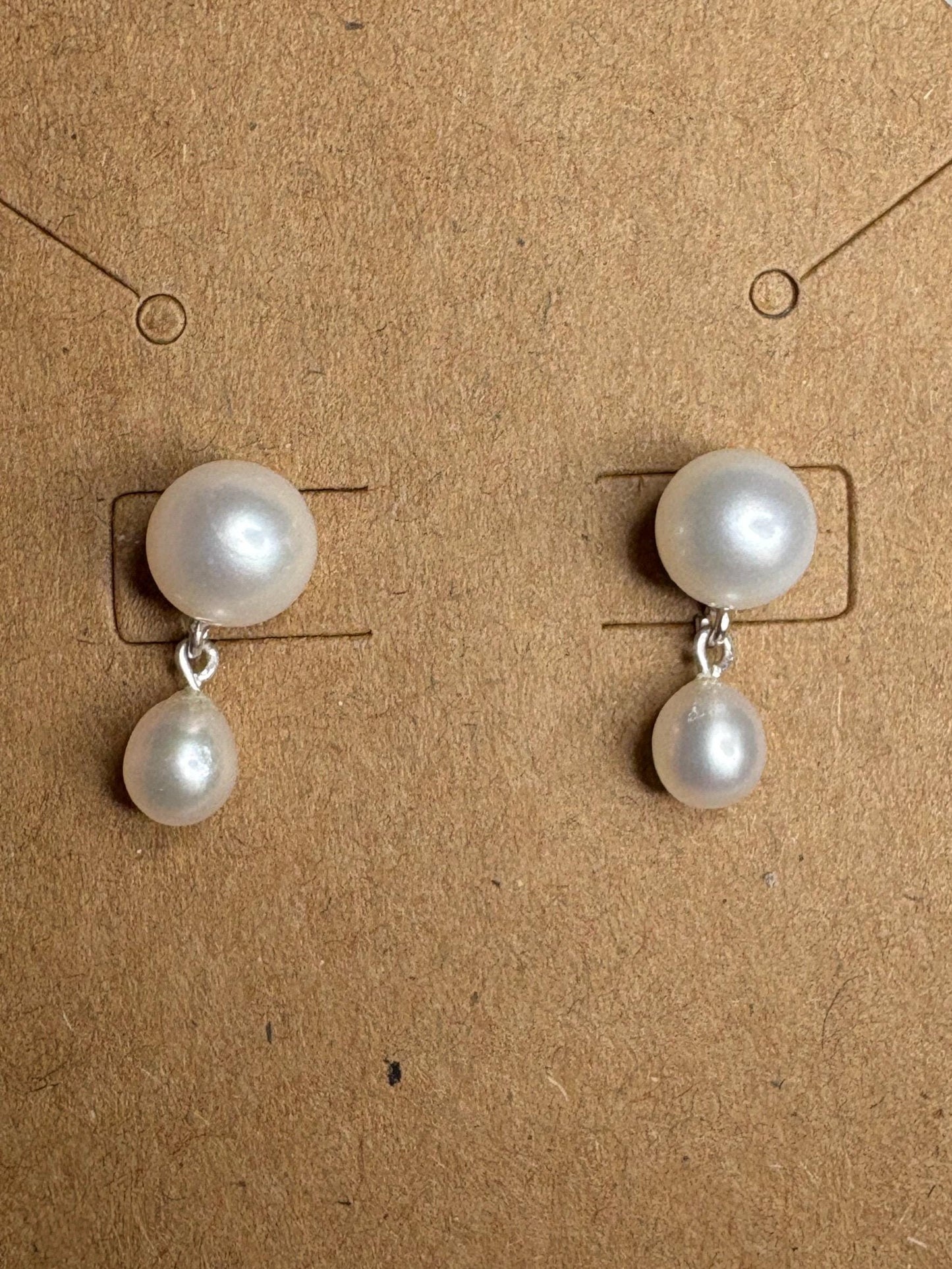 Sterling silver dangle drop earrings featuring vintage freshwater pearls.