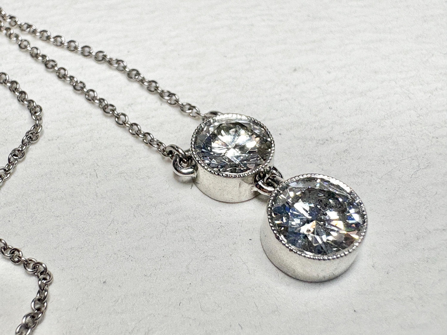 Custom double solitaire natural diamond necklace in solid 14k white gold.