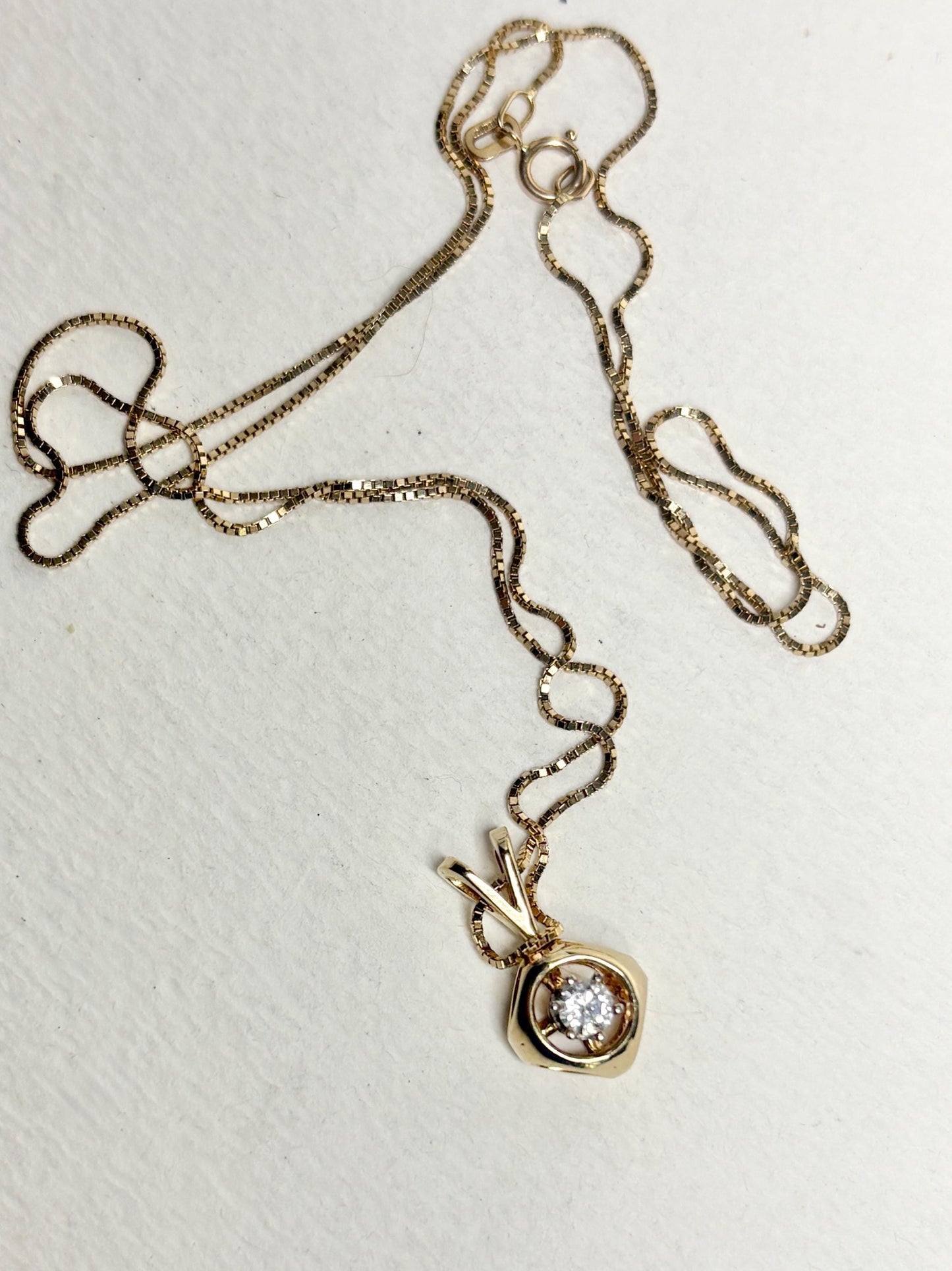 Vintage 14k gold necklace with a diamond solitaire pendant on a 20" box chain.