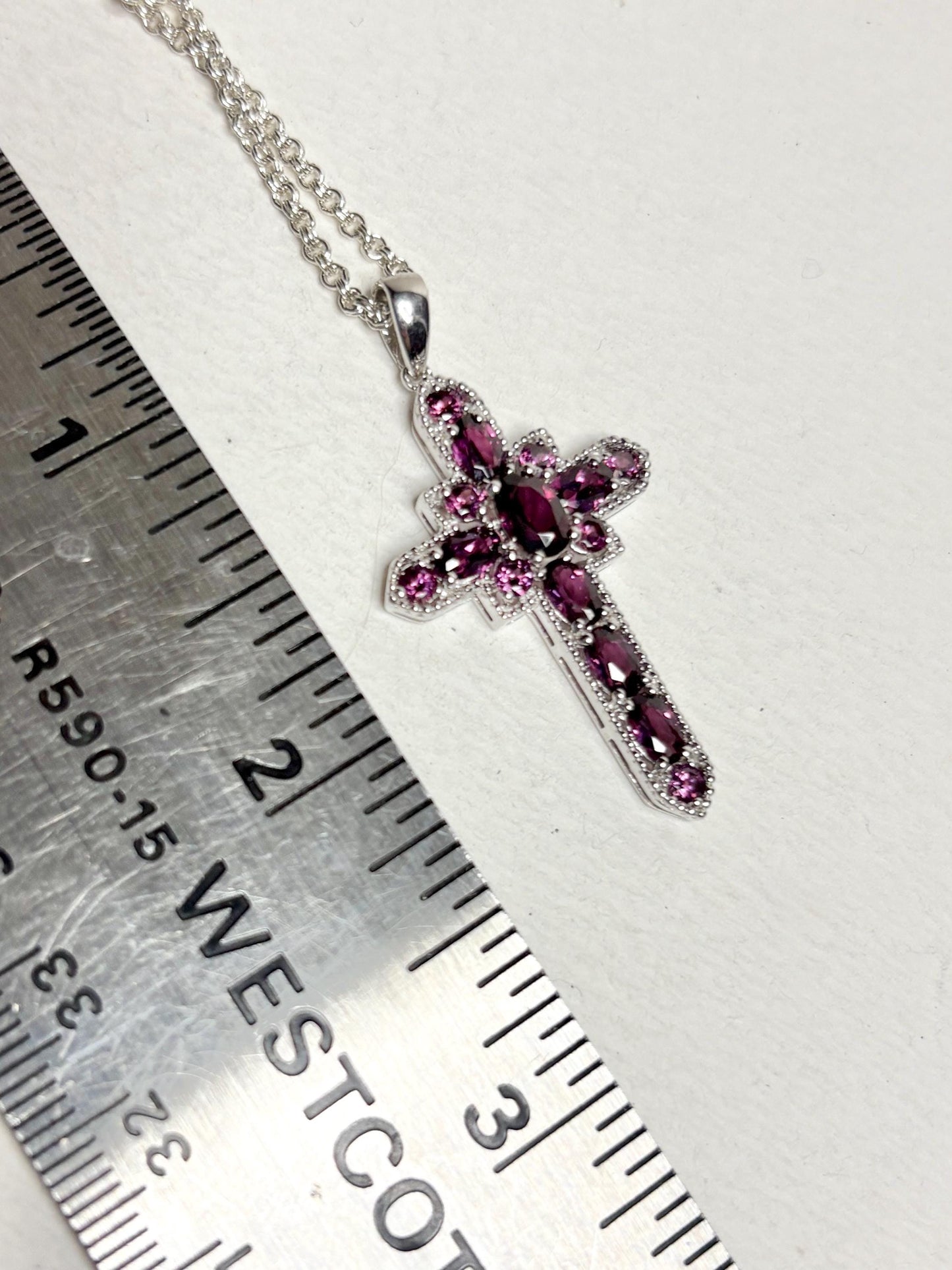Sterling silver cross pendant necklace with rhodolite garnets.