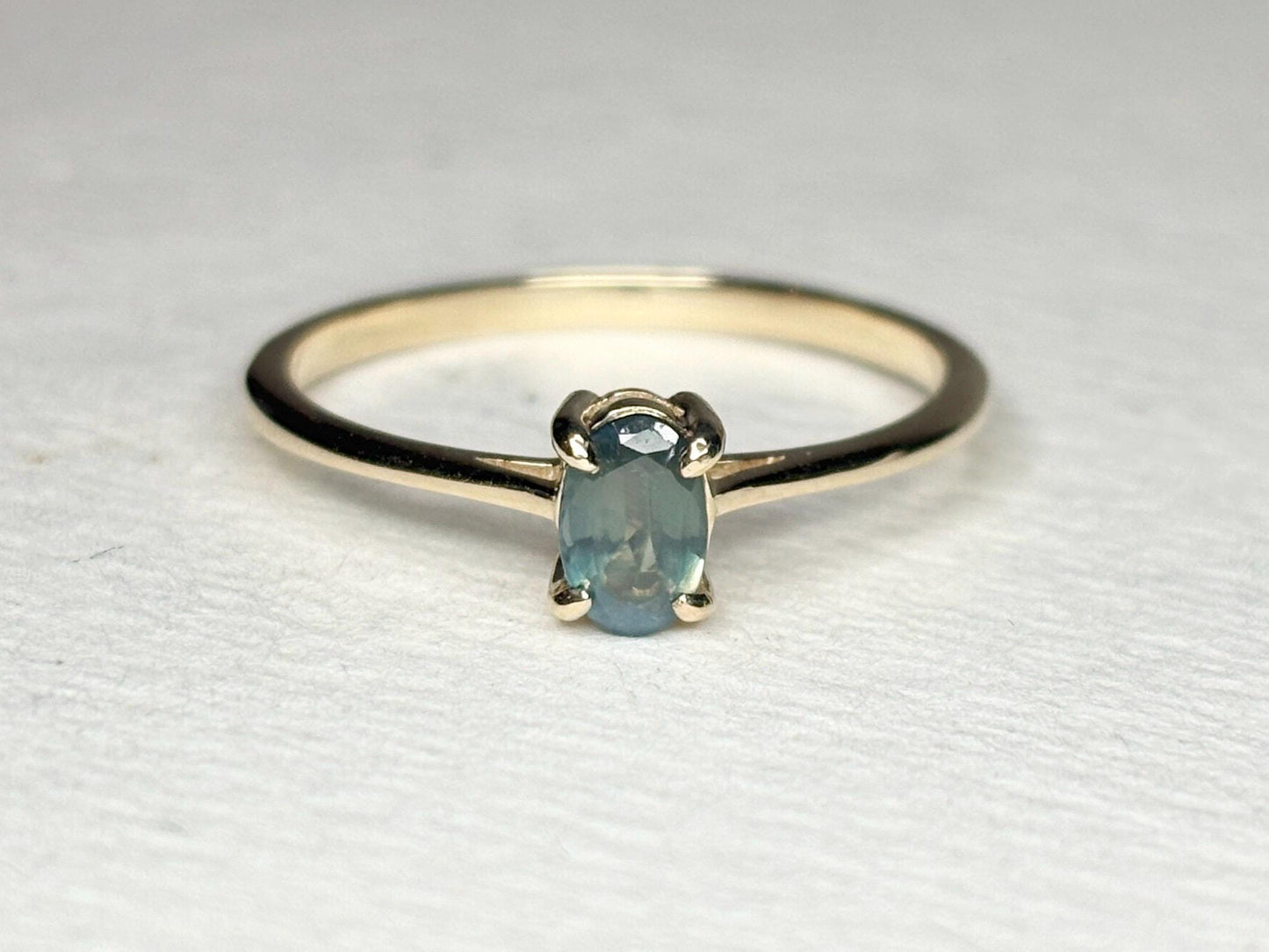 Oval alexandrite solitaire ring in 10k gold.