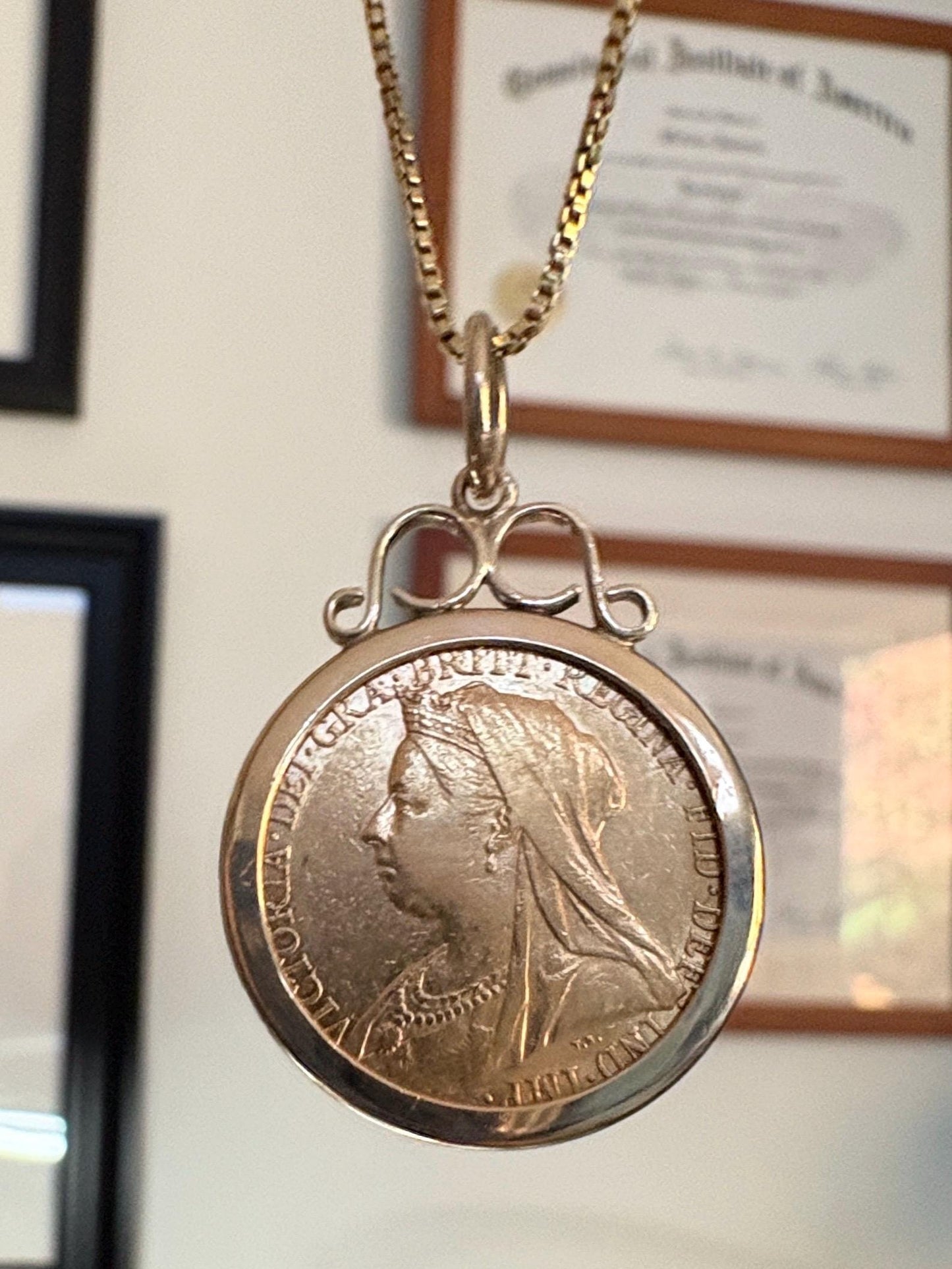 Gold coin pendant with Queen Victoria and a gold chain.