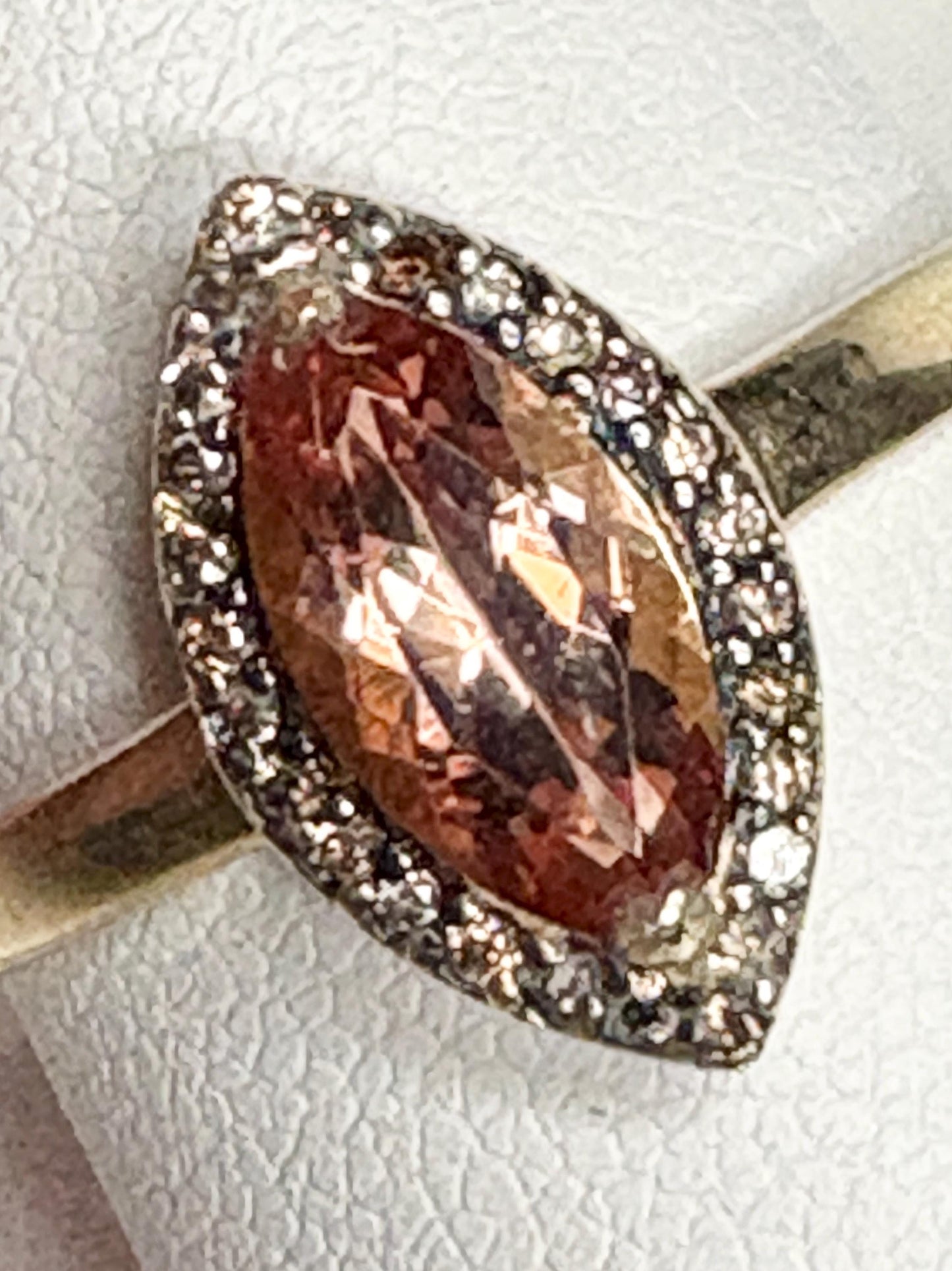 Marquise Oregon sunstone ring with champagne diamonds in 10k gold.