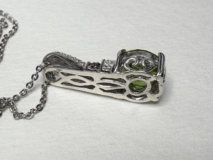 Sterling silver pendant necklace with color-changing glass, moissanite, and multi-color sapphires.