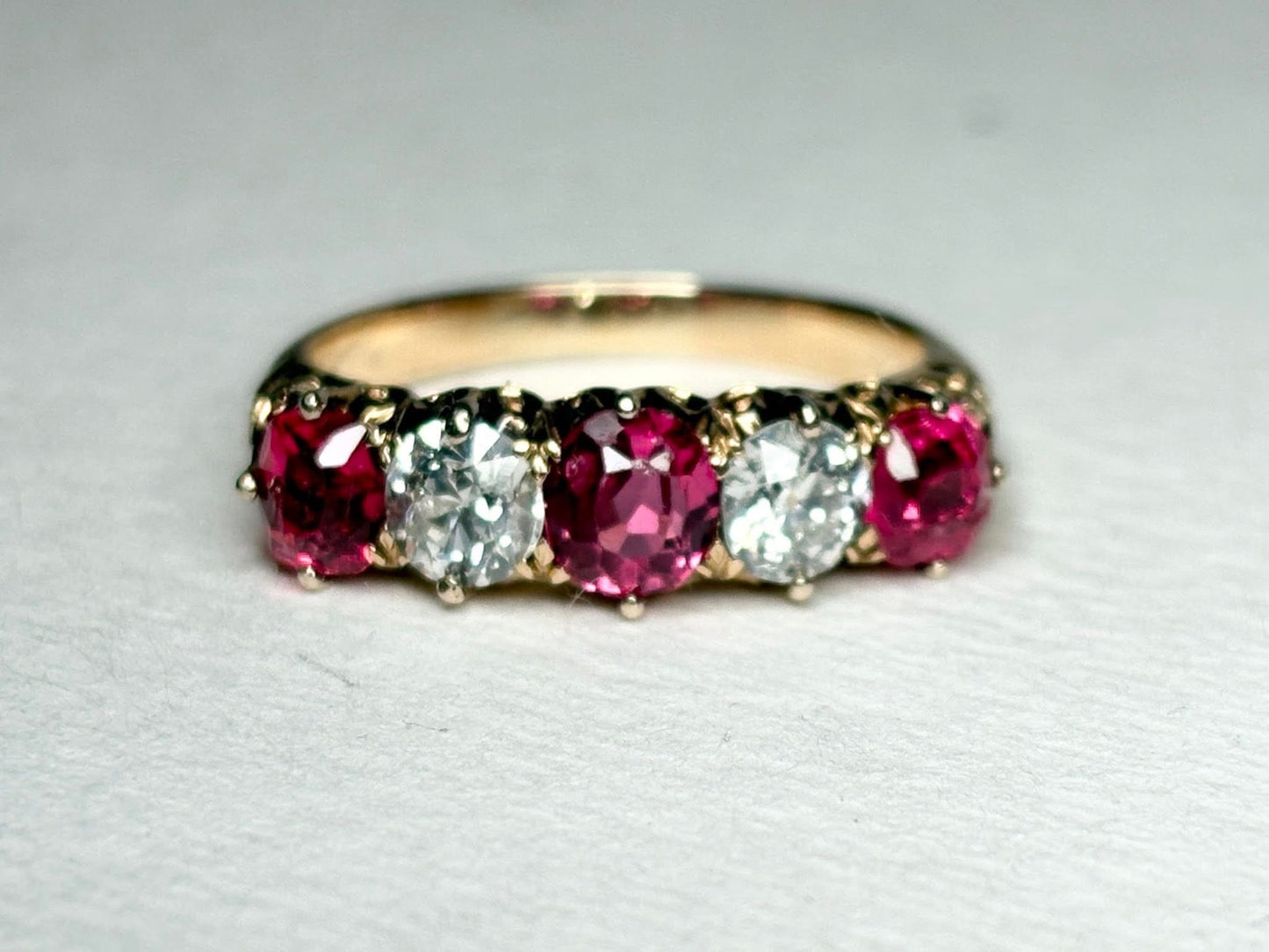Antique 14k gold band ring with red spinel and old mine cut diamonds.