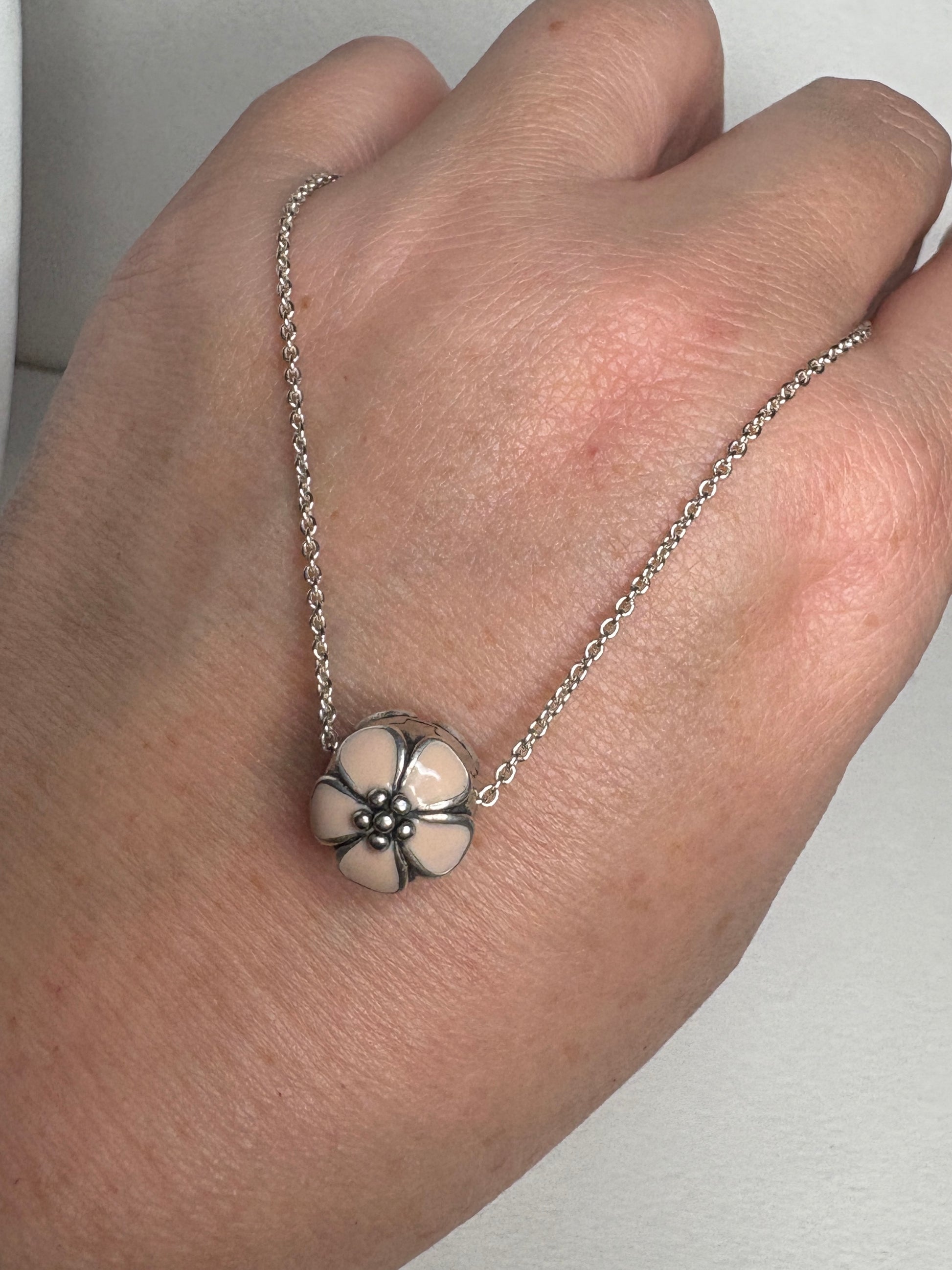 Pandora sterling silver cherry blossom stopper bead on an adjustable chain.