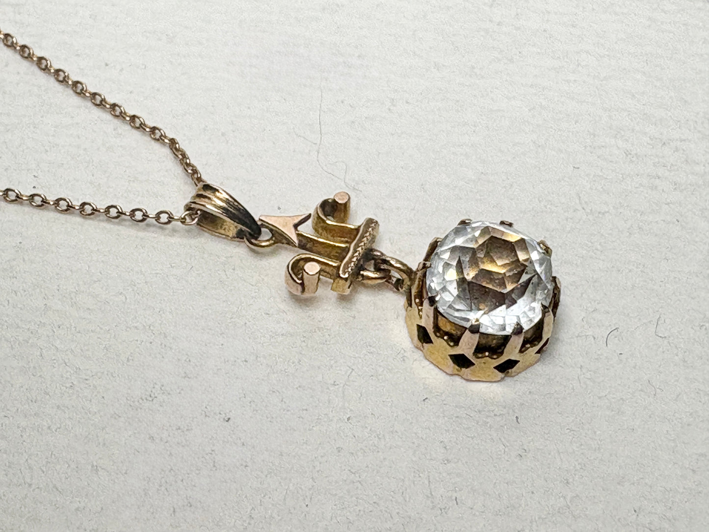 Antique Victorian Etruscan Revival pendant necklace with rock crystal quartz on a 10k chain.