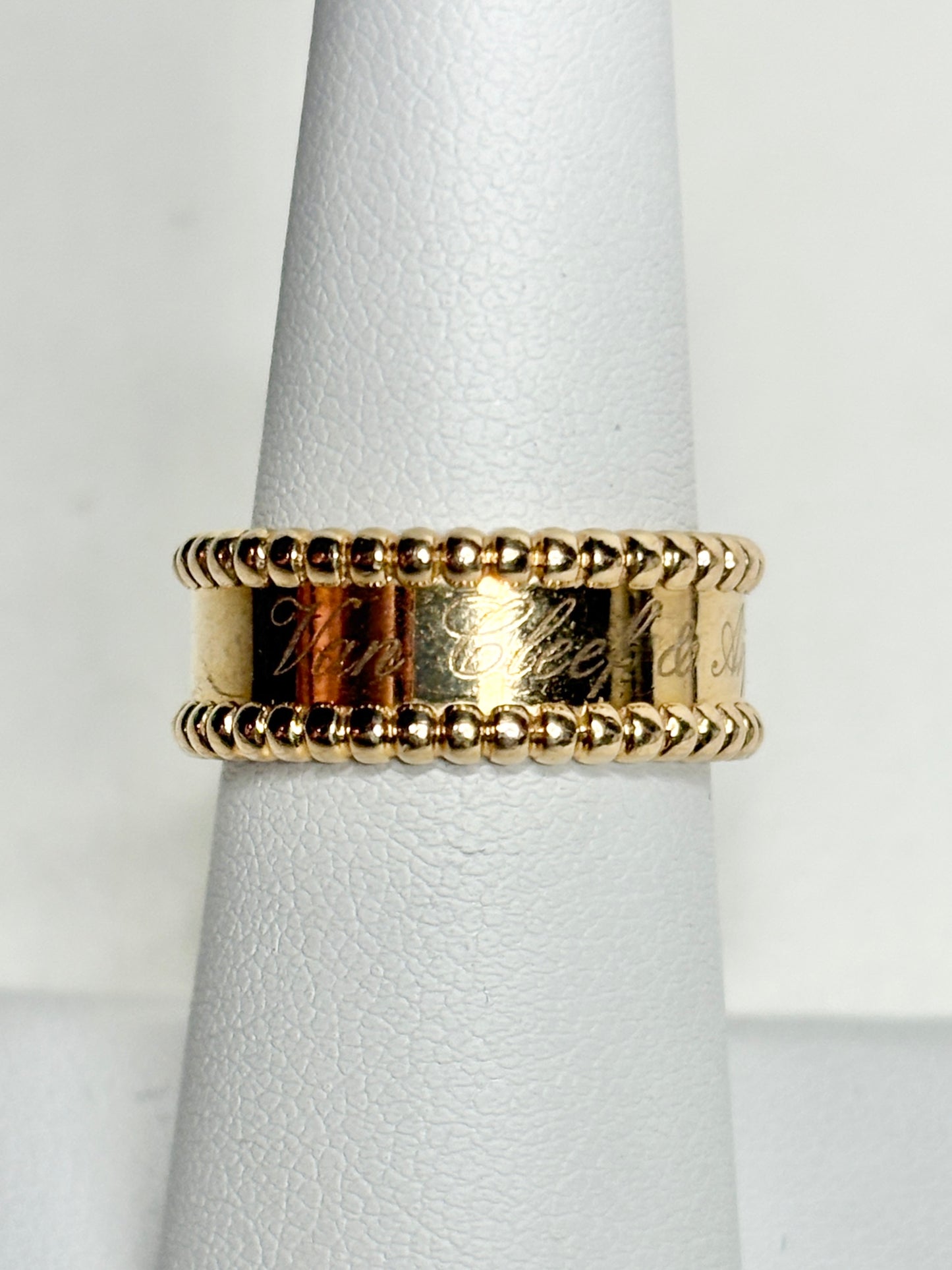 Van Cleef & Arpels Perlee Signature band ring in 18k gold.