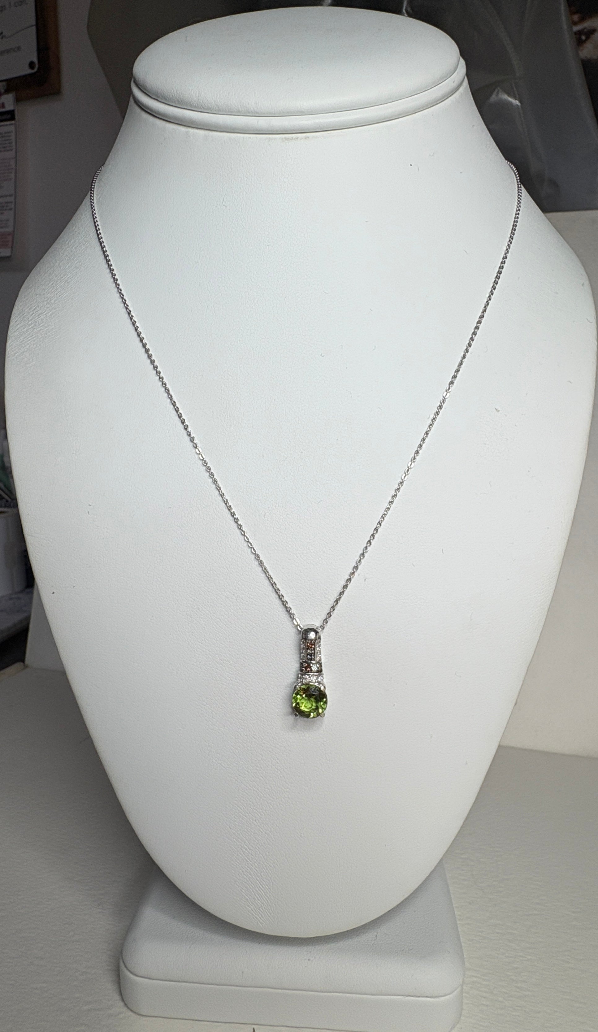 Sterling silver pendant necklace with a color-changing glass stone, moissanite, and multi-color sapphires.