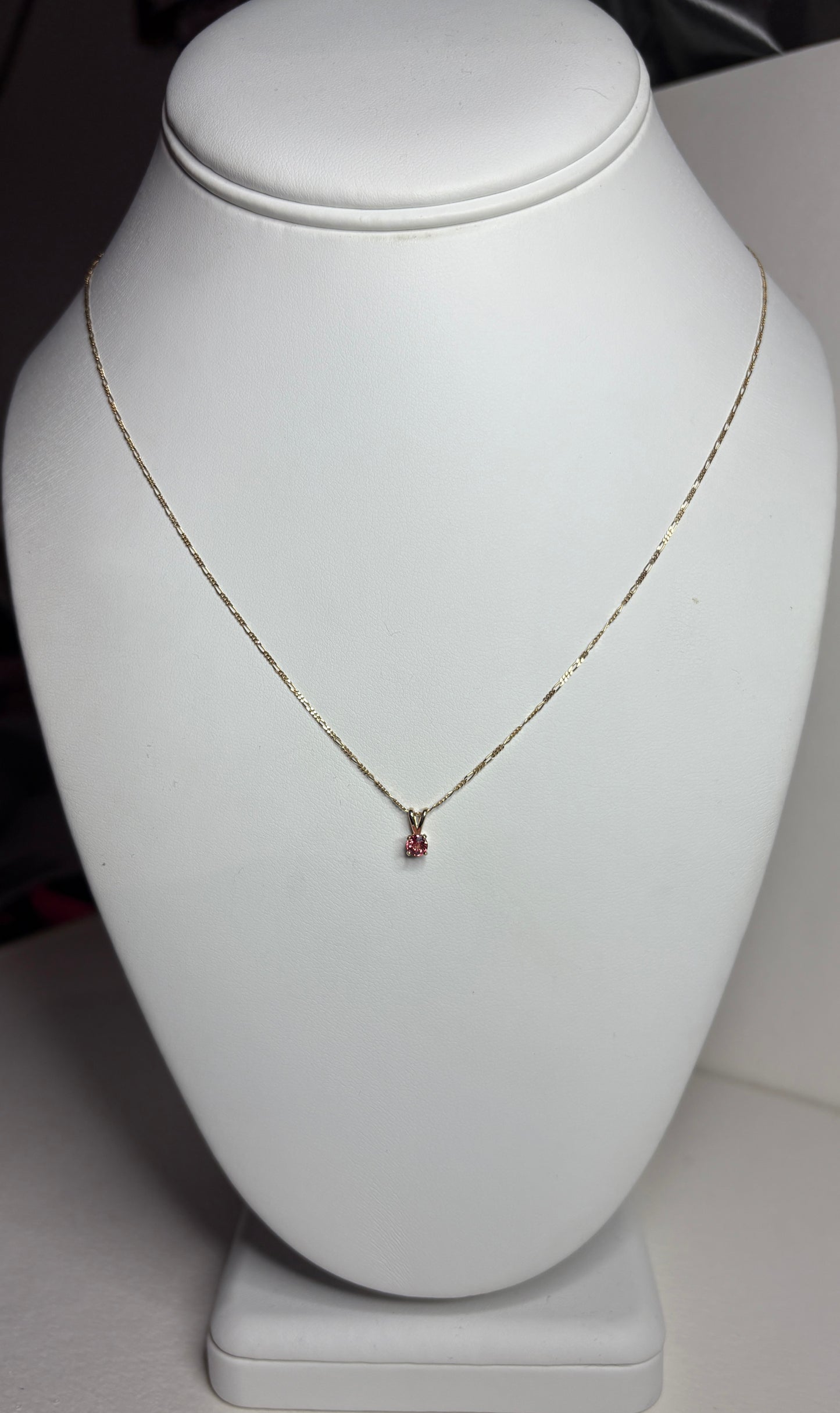 Small padparadcha sapphire solitaire pendant necklace in solid 14k gold.