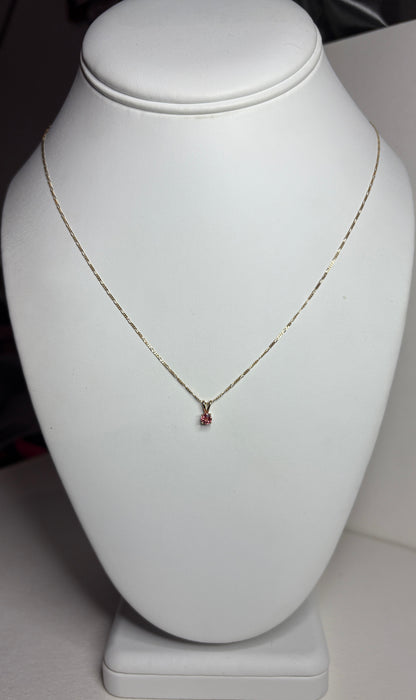 Small padparadcha sapphire solitaire pendant necklace in solid 14k gold.