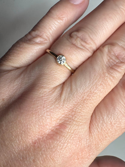 Pandora 14k gold ring with a .25ct bezel-set lab-grown diamond.