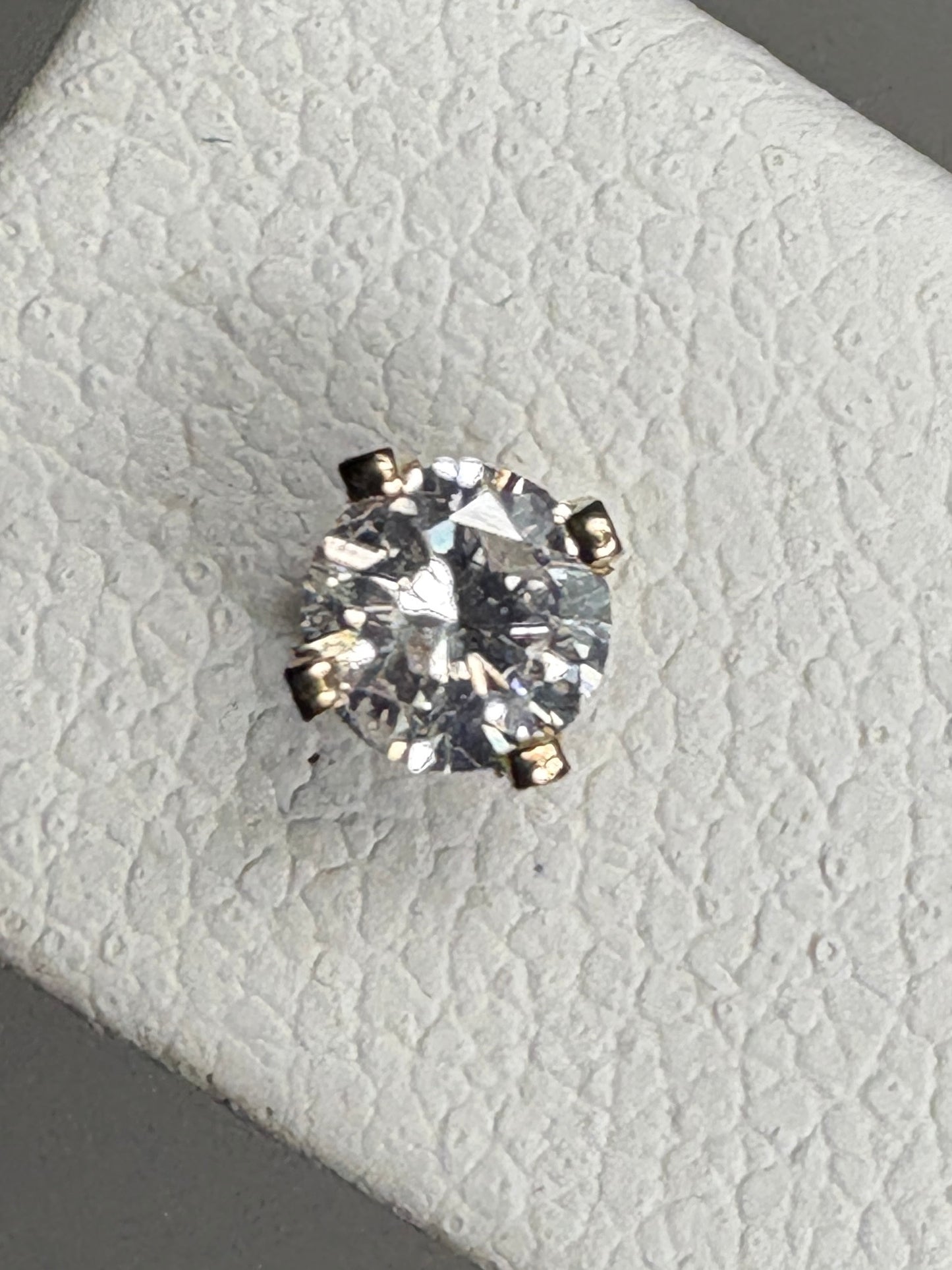 Natural diamond solitaire stud earrings in solid 14k gold.