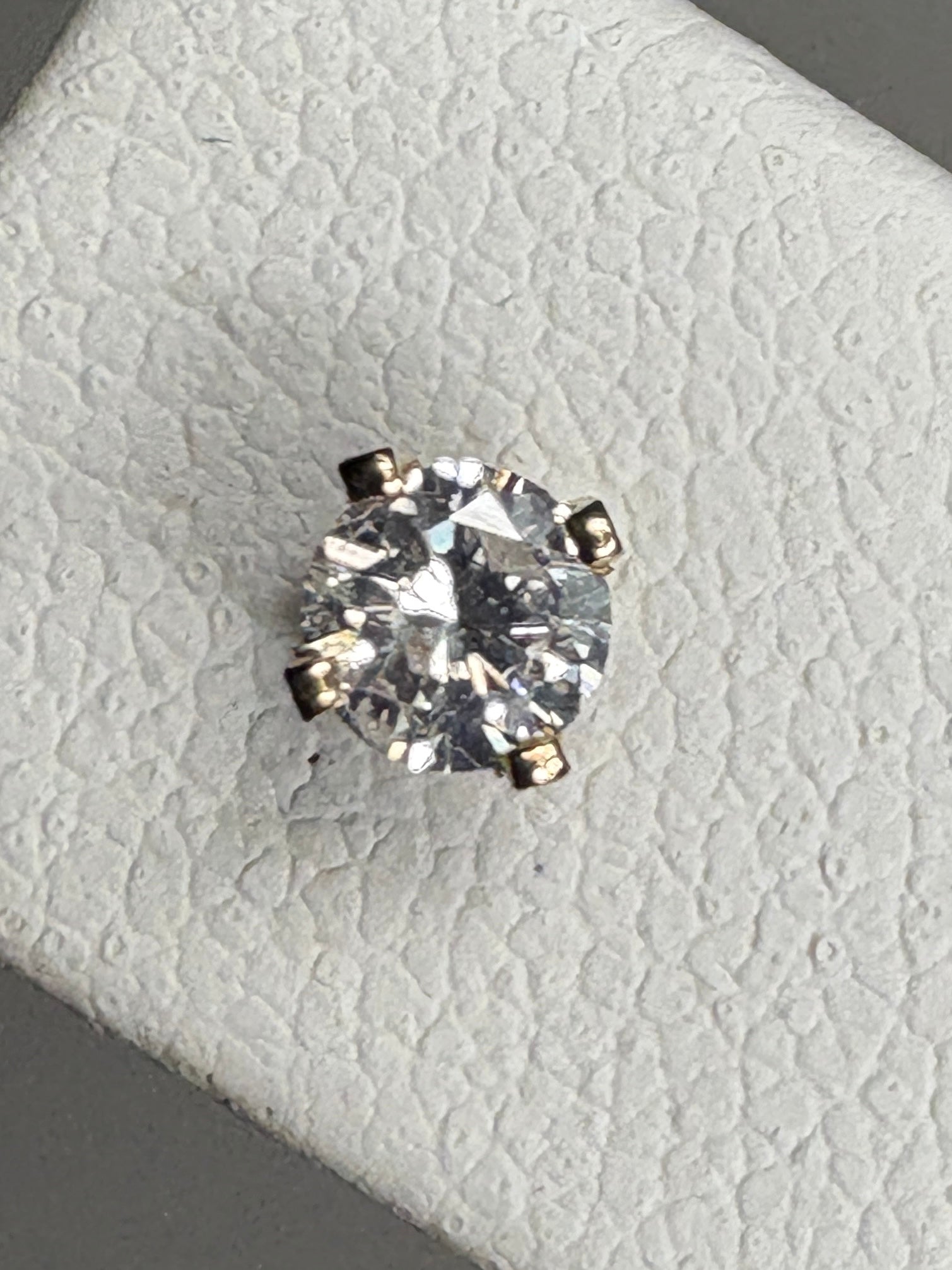 Natural diamond solitaire stud earrings in solid 14k gold.