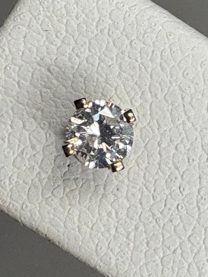 Natural diamond solitaire stud earrings in solid 14k gold.