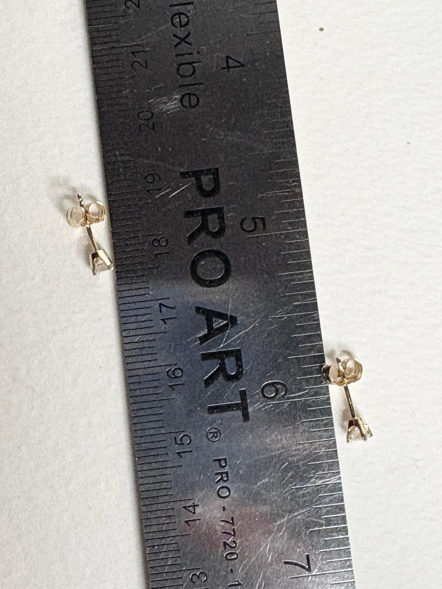 Natural diamond solitaire stud earrings in solid 14k gold.