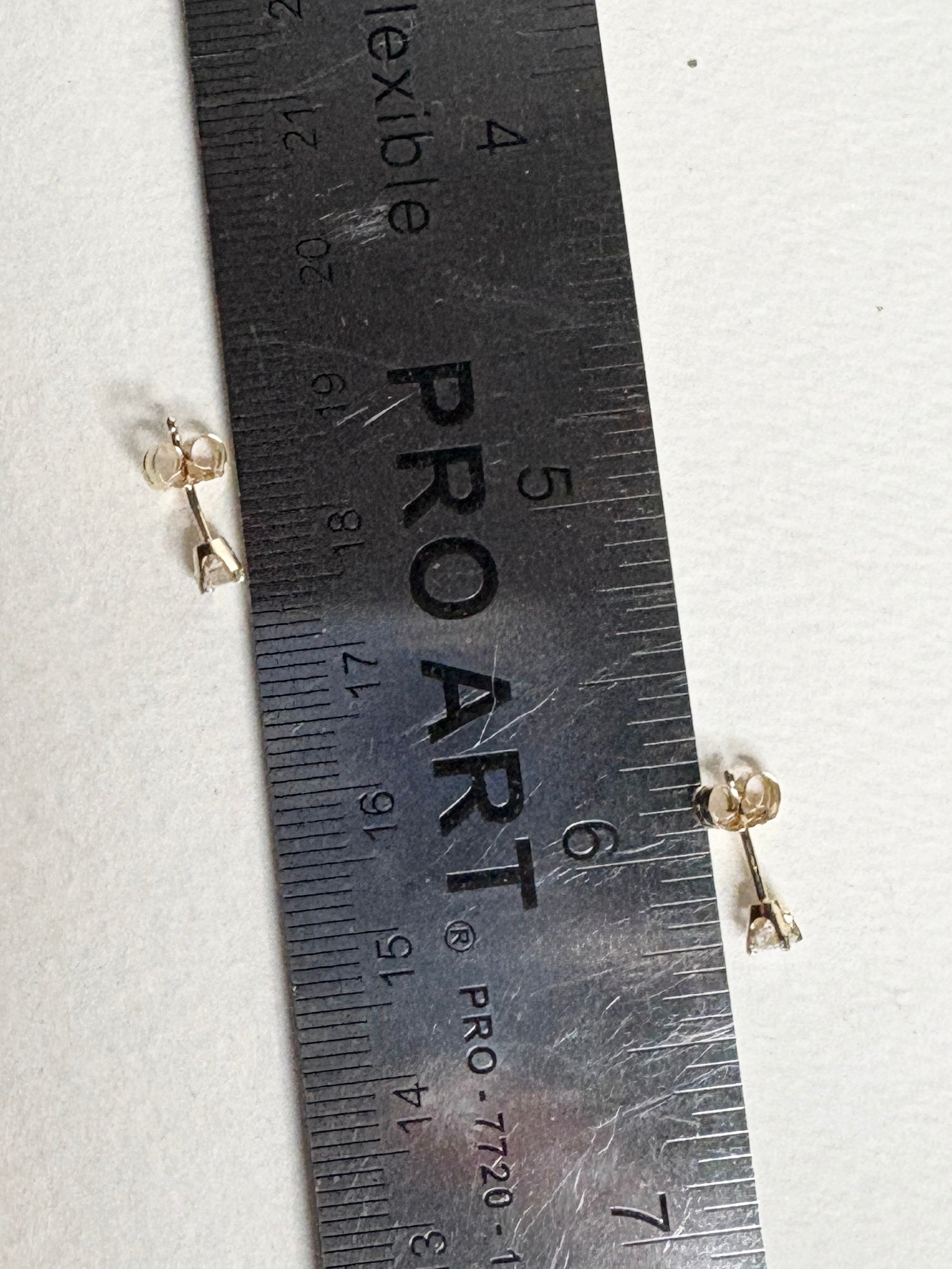 Natural diamond solitaire stud earrings in solid 14k gold.