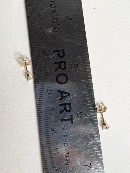 Natural diamond solitaire stud earrings in solid 14k gold.