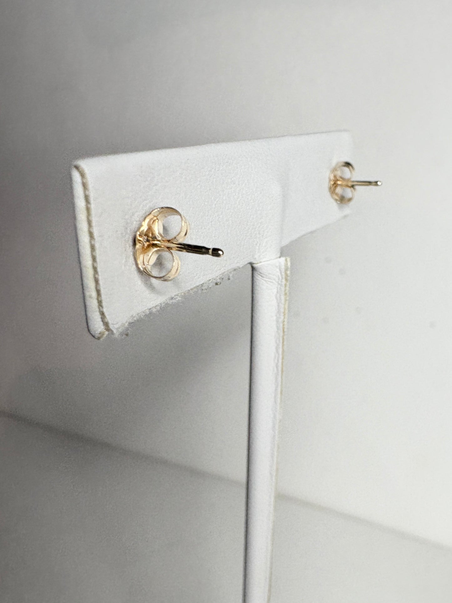 Solid 14k gold stud earrings with diamond backs.