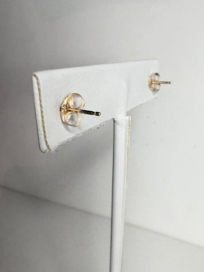 Solid 14k gold stud earrings with diamond backs.