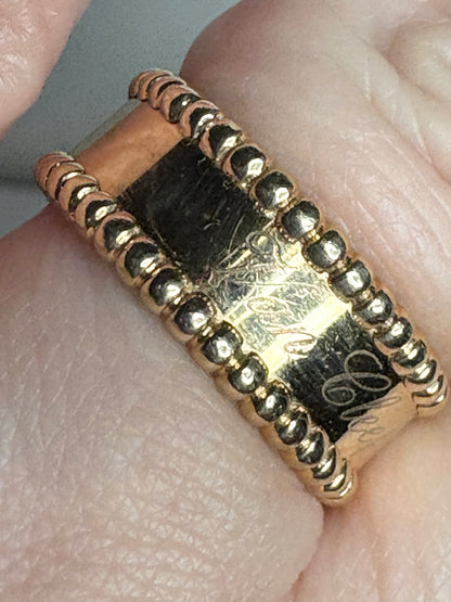 Van Cleef & Arpels Perlee Signature Band ring in 18k gold with beaded edges.