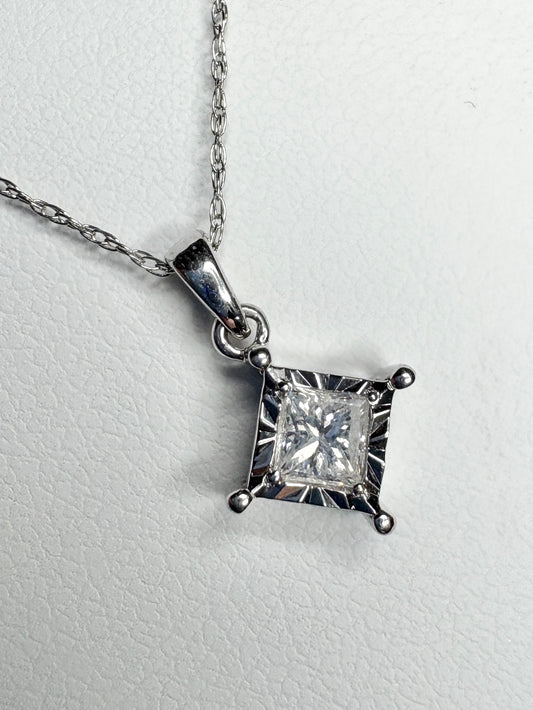 A princess cut diamond pendant necklace on a 10k white gold rope chain.