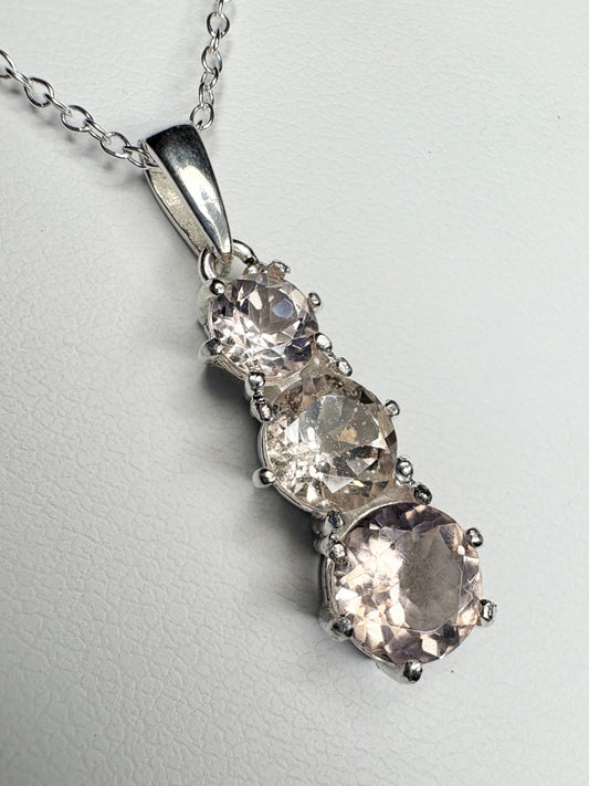 Sterling silver pendant necklace with three natural morganite stones.