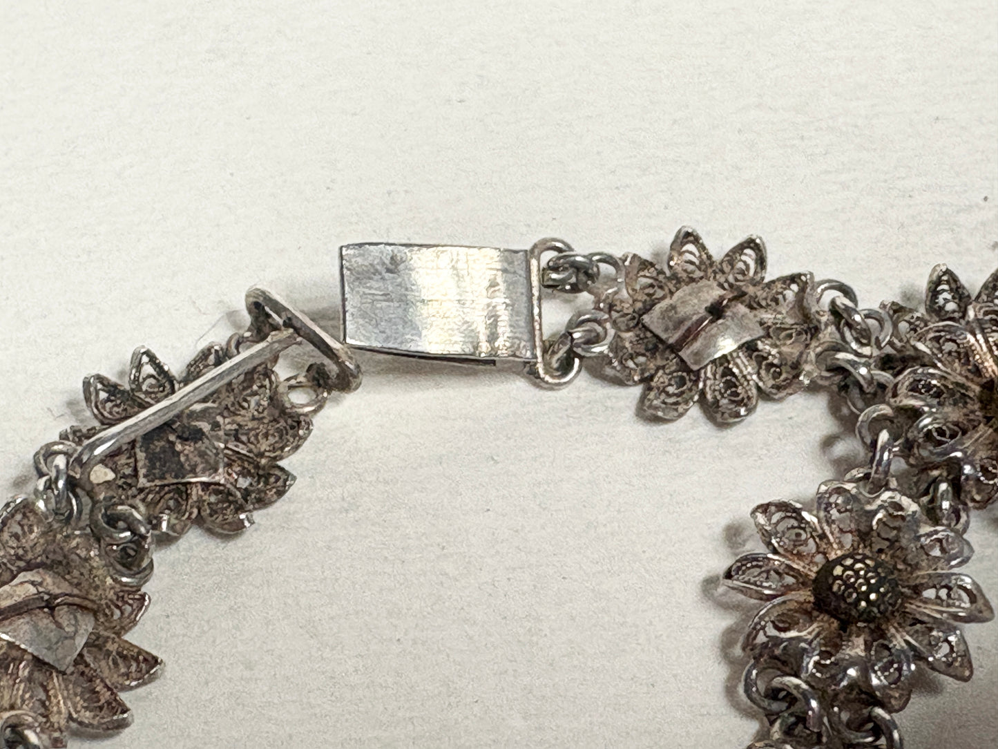 Vintage two-toned 800 silver floral daisy bracelet with gold-plated centers.